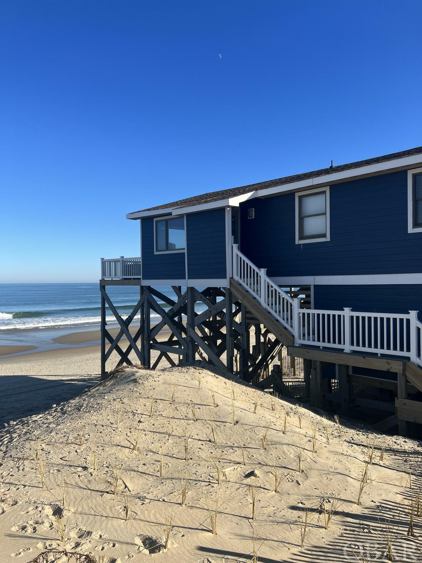 Sold furnished with the exception of a few personal items from seller to be removed prior to sale. 3 bedroom/1.5 bath ocean front income producing STR approved cottage MP 19 S Nags Head w/ 100k in revenue a year being generated. Owners are willing to teach new owners their successful self managing system for maximum income potential/gains. Major 2022 renovation for both structural and cosmetic items completed. Property has benefited greatly from the Beach Nourishment efforts for the OBX!  Assumable FEMA policy and mortgage with excellent rates!