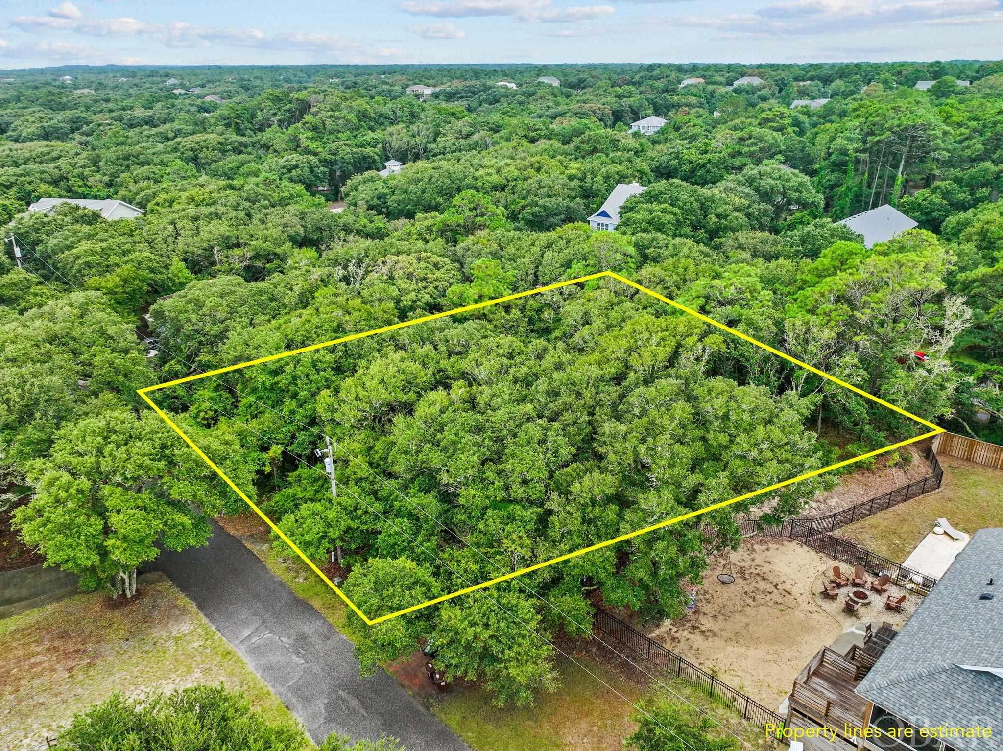 This Oceanside Lot is situated in the sought-after Southern Shores area, boasting a desirable location close to the Hickory Trail. This convenient positioning allows for easy connectivity to the main thoroughfare Duck Rd. Moreover, the lot is just a short walk away to the beach access via a picturesque tree-lined walking trail at the end of Circle Dr. The lot is perfectly suited for creating your custom dream home or a charming beach getaway. Notably, it is situated in an X flood zone, which means that you won't have to worry about costly flood insurance expenses. This makes it an attractive choice for potential homeowners. Additionally, this property presents a promising opportunity for those interested in an investment rental property, given its location and desirable features. There is an optional membership available to the Southern Shores Civic Association (SSCA). This membership offers various perks, including access to a marina, a serene sound-side beach area, parks, and other amenities. This adds further appeal to the property, enhancing its value and potential for a well-rounded coastal lifestyle. This lot is truly a rare find in the Southern Shores community, as it's one of the few available parcels in this sought-after area. With its prime location, proximity to the beach, and potential for building your dream home or investment property, it presents an exceptional opportunity for those looking to make the most of coastal living in a highly desirable neighborhood.