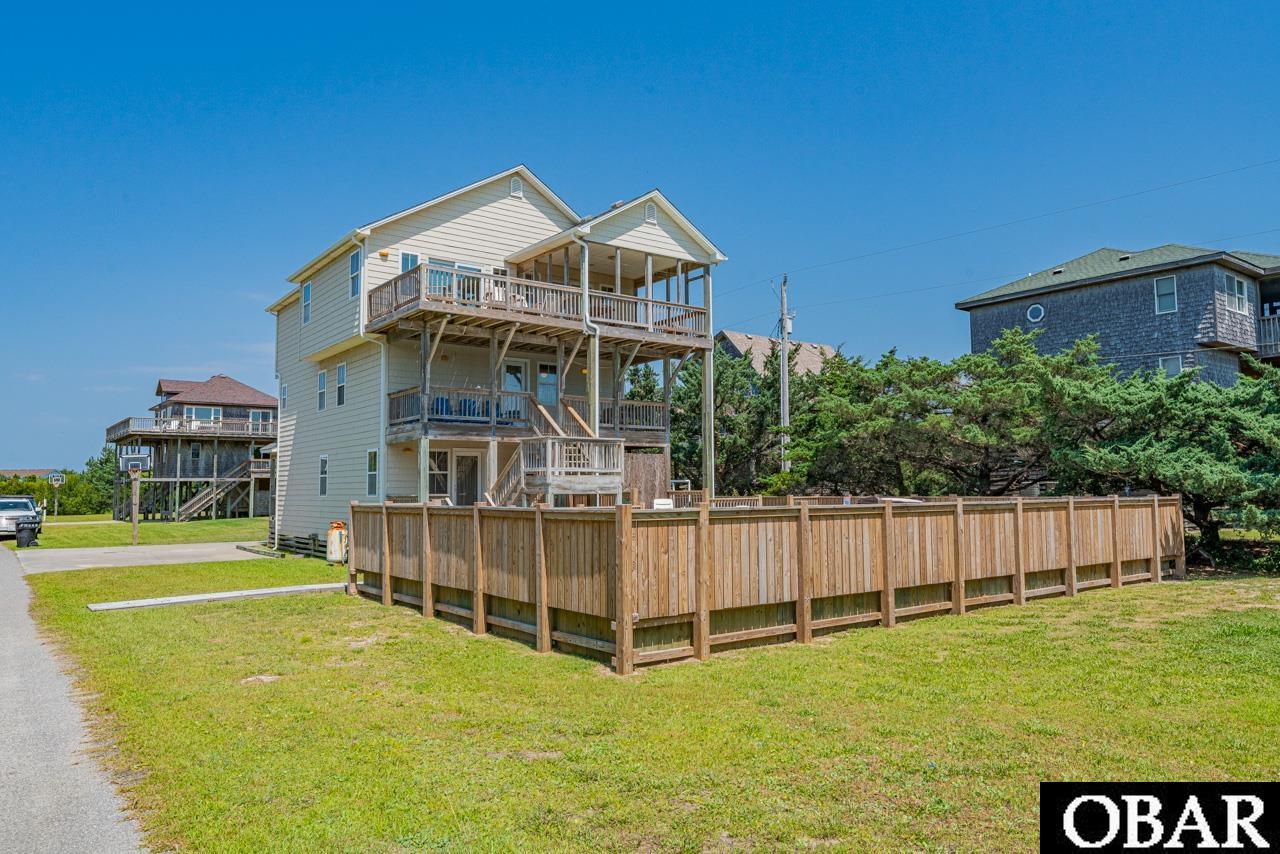 This home will be easy to show from 9/16-9/23, as the owner's will be in town! Schedule through ShowingTime! Experience coastal living at its finest in this exceptional Frisco home! Generating over $66,000 in 2023, this investment gem offers not only unbeatable returns but a lifestyle of comfort and luxury. Recent upgrades are evident throughout, including a brand-new pool and hot tub added in 2022, ensuring relaxation and entertainment are always within reach. The fortified roof, added in 2021, adds peace of mind and durability to this already stunning property. Location couldn't be better - mere steps from the pristine and uncrowded beaches of Hatteras Island. This oceanside retreat welcomes you with open arms, offering something for everyone. The ground level game room provides endless entertainment with a TV, foosball table, and mini-fridge. A queen bedroom with a semi-private bath is also conveniently located on this level, providing easy access to the pool area and covered deck. On the middle level, a queen en suite bedroom grants soothing views and access to a shaded deck. Additional bedrooms, including one with two bunk sets and another with two single beds, share a full bath in the hall. The laundry area is thoughtfully placed on this level, adding convenience to everyday living. The upper level boasts an inviting open living, dining, and kitchen area, perfect for gathering and making memories. Panoramic ocean views and abundant natural light set the stage for comfort and relaxation. A gas fireplace adds warmth and ambiance during winter evenings. The king en suite bedroom provides a serene retreat, complete with a built-in desk area and a spacious private bath. Enjoy stunning sunrises and sunsets from the sundeck and covered porch, or dine al fresco with family and friends. Access to one of Hatteras Island's most sought-after stretches of beach is right at your doorstep, just a short stroll via the sand path at the end of the street. Spend your days basking in the sun, playing in the waves, and building sandcastles from this idyllic haven. And when you're ready for more island exploration, shopping, dining, and a wealth of other adventures await just a brief drive away. Don't miss the chance to own this captivating oceanside retreat that perfectly blends comfort, luxury, and exceptional investment potential. Embrace the coastal lifestyle you've been dreaming of - schedule your private tour today!