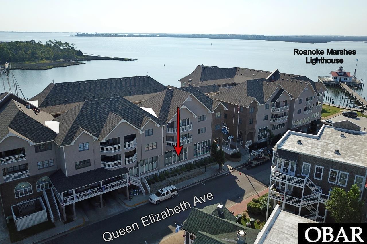 Nestled in Historic Manteo's thriving Social District, this waterfront commercial/retail condo offers a unique opportunity to establish your business in a burgeoning coastal community. With captivating water views and a prime location, this space is ideal for realizing your creative vision.  Features:  Prime Waterfront Location: Situated along Manteo's picturesque waterfront, the condo offers captivating views of the marina and a high-visibility storefront, perfect for attracting foot traffic.  Versatile Interior: With an open layout, the space is customizable for various uses such as a retail showroom, art gallery, or café, allowing you to capture the district's vibrant energy.  Coastal Aesthetic: The condo's architecture harmoniously blends with the coastal surroundings, creating an inviting atmosphere that connects indoor and outdoor spaces.  Foot Traffic Hub: As part of the Social District, you'll benefit from steady foot traffic drawn to the area's cultural and entertainment attractions.  Accessibility: Positioned in downtown Manteo, surrounded by shops and restaurants, the condo offers easy access and convenience for customers.  Investment Potential: With the district's ongoing development, this condo presents a strategic business opportunity and future investment.  Join Historic Manteo's Social District and seize the chance to be a part of this coastal community's growth.  **BUSINESS NOT FOR SALE**