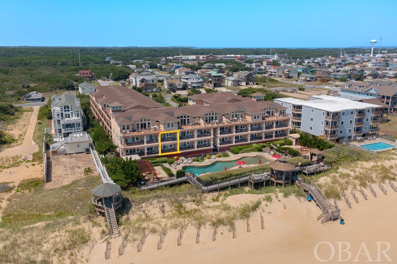 Oceanfront Townhome located in the Prestigious Oceanfront Resort, Croatan Surf Club. This First Class Community boasts all the amenities one could desire for a fabulous beach vacation. This 3 bedroom/3 bath townhouse has upgraded appointments throughout including hardwood floors, custom tile, granite countertops, fireplace and much much more. Enjoy the forever views of the Atlantic Ocean, the oceanfront custom 84 foot outdoor pool and spa from the spacious covered oceanfront decks. Other amenities include a children's pool with spray ground, indoor heated pool with spa, workout facility, boardwalk to the beach with gazebo and of course access to one of the best beaches on the East Coast. Sold completely furnished for ones immediate enjoyment, either as a place to call home at the beach, for the discriminating vacationer or great rental investment. Check out the Croatan Surf club Today!!!