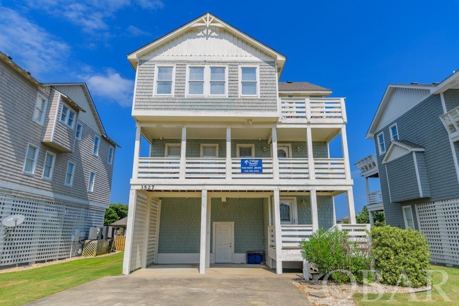 Beautiful Beach Home in between the highways with an amazing location just a short walk to the beach.  This home is located just around the corner from a public beach access.  Although Old Nags Head Place is a quiet neighborhood it is in the heart of Nags Head and close to restaurants, bars, state parks, the beach, shopping, grocery, and much more.  Whether you choose to use this home as a second home or investment rental the location and size are perfect.  This beach home continues to prove its strong rental numbers.  Renters enjoy the large decks, huge back yard with pool and tiki bar that are perfect for entertaining family while grilling out.  The ground floor has plenty of space to entertain as well with the pool table and wet bar that are just steps away from the pool.  The reverse floor plan offers views from the top deck and an open concept on the top level.  The mid level houses the bedrooms and laundry.  The home has been well maintained and has many updates such as New Fridge in 2019; Hot Water Heater & Partial Lower level AC 2020; LVP Flooring in 2021, Pool Pump, Pool Gate, Hot Tub Pump, Tile in Master Bathroom, Chair & Recliner all in 2022; Microwave, top level air handler, top level heat pump 2023.