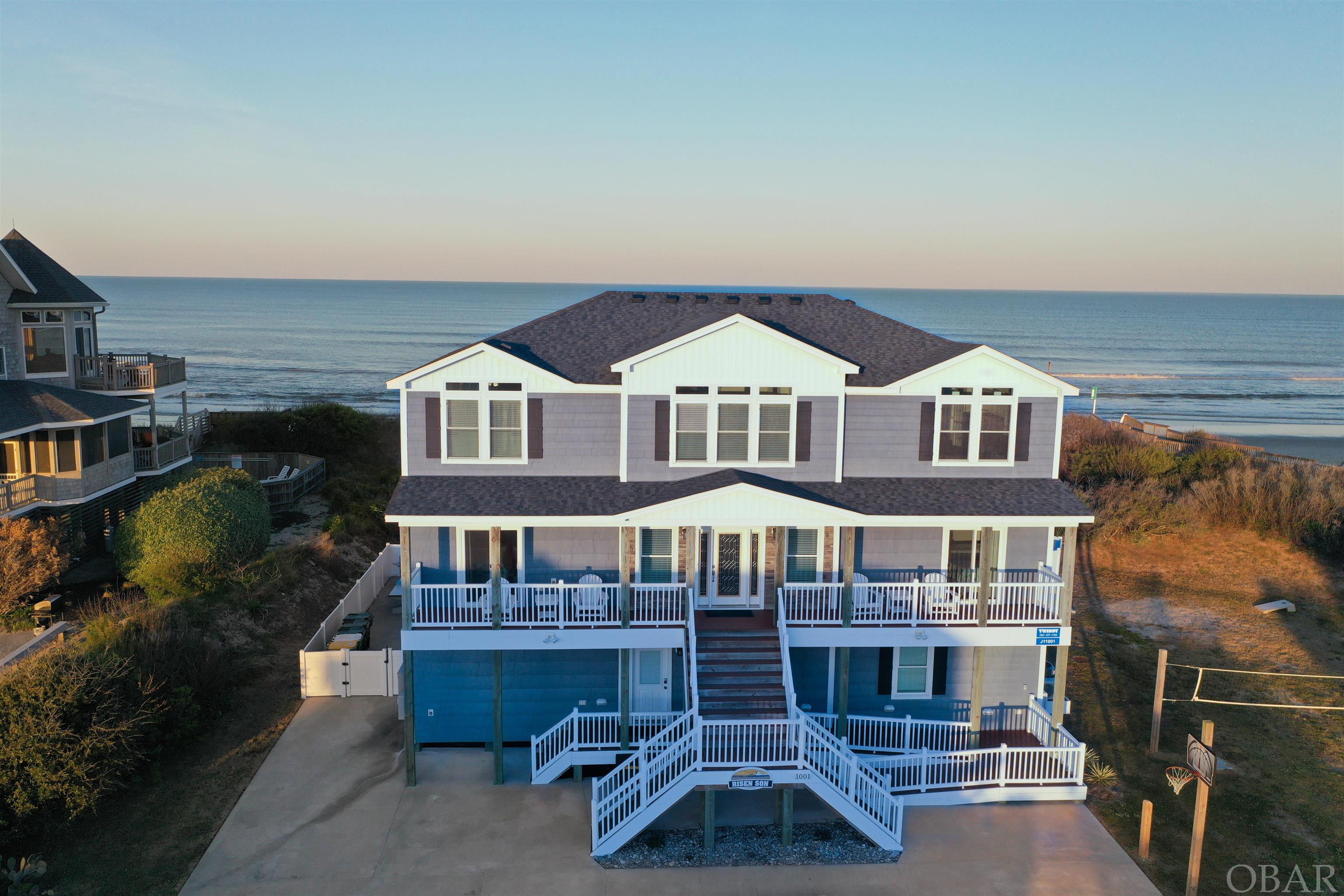 Oceanfront custom built home in the sought after Whalehead Club.  This builder had a design in mind to maximize space while creating a resort-like atmosphere. Owners and guests will enjoy endless Ocean views from the decks.Beautiful sunsets on the west and gorgeous sunrises from the east ,paradise!Easy access to all floors with the elevator. This can be a great destination beachfront home for all occasions. Easy walk through to the beach on the newly redone dune deck. Engaging outside amenities including heated saltwater pool with waterfall, recently added concrete ping pong table, foosball and corn hole Boards. There is a volleyball court and basketball hoop. No need to go inside when the Pool cabana includes a kitchen area with refrigerator, gas grill, Built to last furniture, TV, Stereo, bar and 1/2 bath with an outside shower. 11 suites all including their own bathrooms. This reverse floor plan has 3 Levels of living featuring a game room, theater and workout room on the first floor. A living room on the second floor. The 3rd floor is a Gourmet Kitchen with 2 double oven ranges, 2 dishwashers, 2 refrigerators , 50# ice maker and breakfast bar. The dining area consists of 2 large tables overlooking the ocean. This destination home was built for rentals with commercial grade LVP and carpet, 50 year landmark pro shingle with a zip roof underneath. Trex decking and upgraded shake siding no detail was overlooked fasteners all  stainless steel.This location allows easy access to restaurants, stores and the many activities in the area. Or Enjoy your personal paradise. Rental projections on file.This one of the top performing homes in Whalehead! Come visit The Risen Son today. Add to your Investment  portfolio.   Great investment excellent location! Call to see!