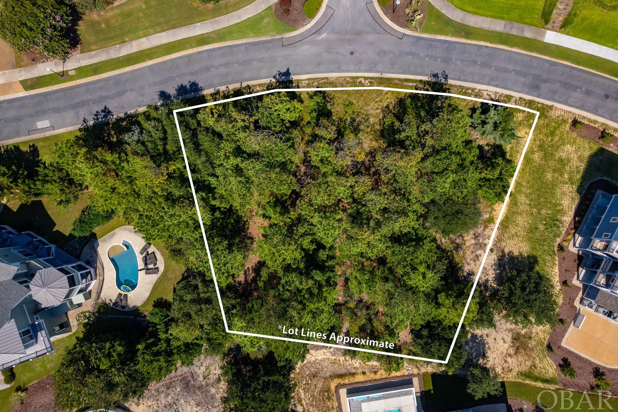 Great Location! Premiere Lot in the Currituck Club, 17,532 sq.ft. to build your home in paradise. Capture this opportunity with very few lots remaining. Drive by and see how amazingly easy it will be to clear and build. Flood zone X. So No worries.  Call Mary with any questions, 301-785-1601