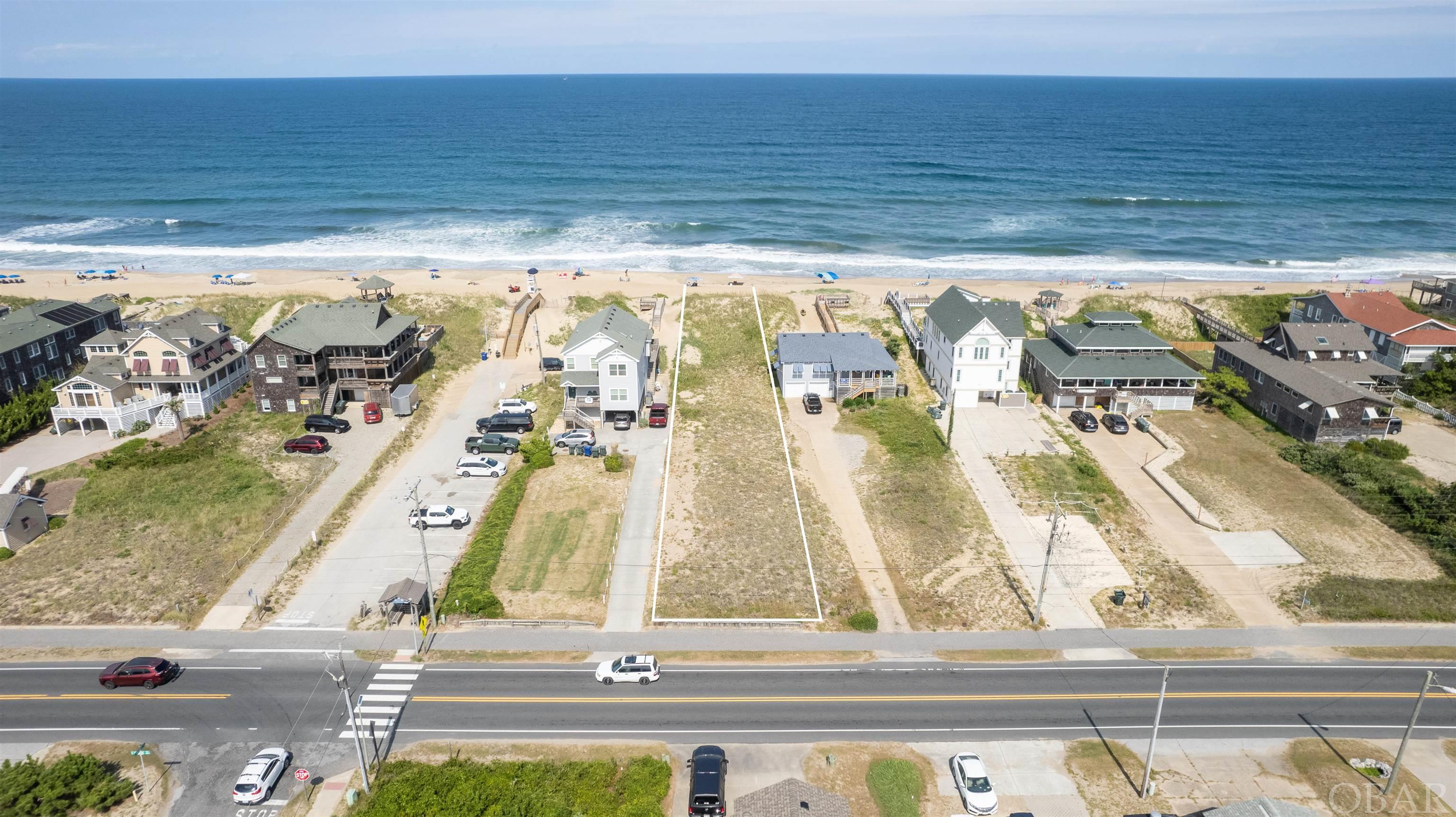 Rare opportunity: A 50' premium oceanfront lot in the heart of old Nags Head.  Deep lot is protected by large dunes covered with vegetation and a beautiful wide sandy beach.  This is currently the only active oceanfront listing in Nags Head.  The lot is identified as Lot 155R (previously identified as Lots 50 and 150).  Encroachment from small portion of existing structure and driveway of the southern border of the lot are identified on the recent survey, which is available to a prospective buyer upon request.