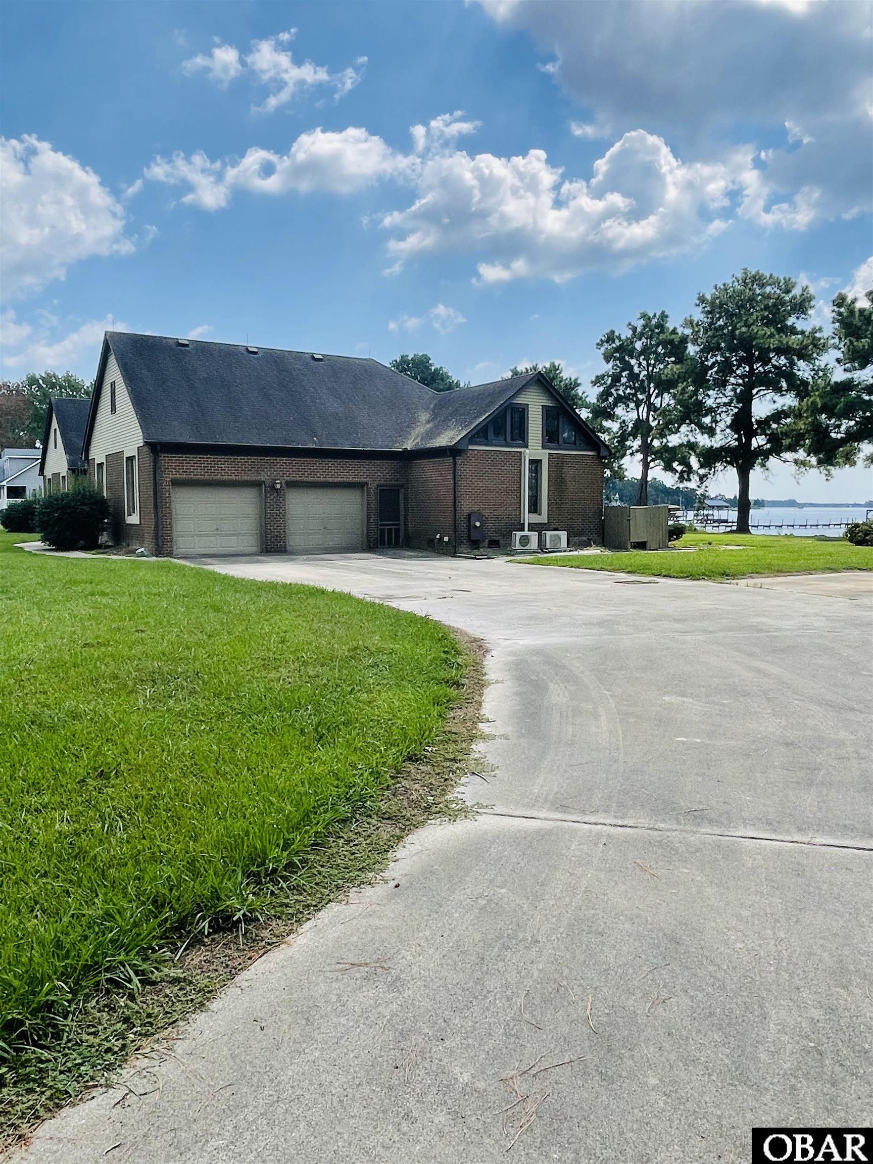 Two car garage w/ lots of concrete parking.
