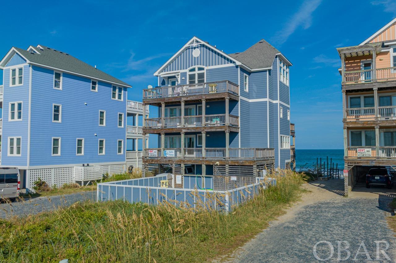All we can say is WOW! Dive into the pinnacle of coastal luxury at Hydro-Therapy, a masterpiece nestled right on the Rodanthe Oceanfront. This 5-bedroom, 5 full and one half bath residence promises unparalleled elegance and comfort. Every morning, wake up to mesmerizing ocean and sound views that craft a tranquil start to your day. When it comes to amenities, Hydro-Therapy has it all: dive into the pristine private pool, soak in the therapeutic hot tub, or freshen up with an outdoor shower after a sandy day at the beach. Inside, challenge your friends in the state-of-the-art game room, complete with a wet bar, or move effortlessly between the home's levels with the built-in elevator. Whether you're sunbathing on the sunny deck or finding solace under the covered deck, the options are abundant. The bedrooms are airy sanctuaries, ensuring a restful night. Central to the home is the breathtaking great room. Cathedral ceilings soar high, while floor-to-ceiling windows frame the expansive ocean, and a cozy gas fireplace sets a warm, inviting ambiance. Culinary enthusiasts will adore the gourmet kitchen, decked out with sleek stainless steel appliances and polished granite countertops. But the allure of Hydro-Therapy isn't just in its features. It's prime location places it a stone's throw from the iconic Rodanthe Pier. Moreover, the vibrant village heartbeat, filled with shopping, dining, and entertainment options, is just a short walk away. As an investment, it shines too, boasting an impressive 165,000 on the rental books for 2023. Hydro-Therapy isn't just a residence; it's an invitation to a dreamy coastal life. Seize this once-in-a-lifetime opportunity and make this slice of paradise yours today.