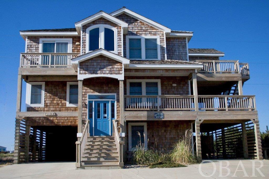 Great opportunity to own an outstanding rental home in the Village at Nags Head. Located in one of the most popular communities in the Village with its own community pool and easy walk to 2 beach accesses. This oceanside home is a favorite of guest due to having 5 MASTER BEDROOMS, ample decking for outdoor sitting and relaxing, screened porch, new hot tub, gameroom with wet bar and spacious top floor living area. In 2022 Sellers added new furnishings and decor, new TV's thru out, bedding, additional kitchen items, etc. Village at Nags Head amenities include: 2 soundside beaches, piers, racks for canoes/kayaks, private ocean beach access with parking, gazabo and bathhouse. For an additional fee join the Village Beach Club for use of the clubhouse, olympic size pool, ocean access and tennis courts. Golf Membership is also available. This home has been well maintained with new Roof in 2017, Hot Water Heater 2020, One Zone HVAC replaced in 2021, 2nd HVAC Zone in 2008 and Interior Painted in 2021.