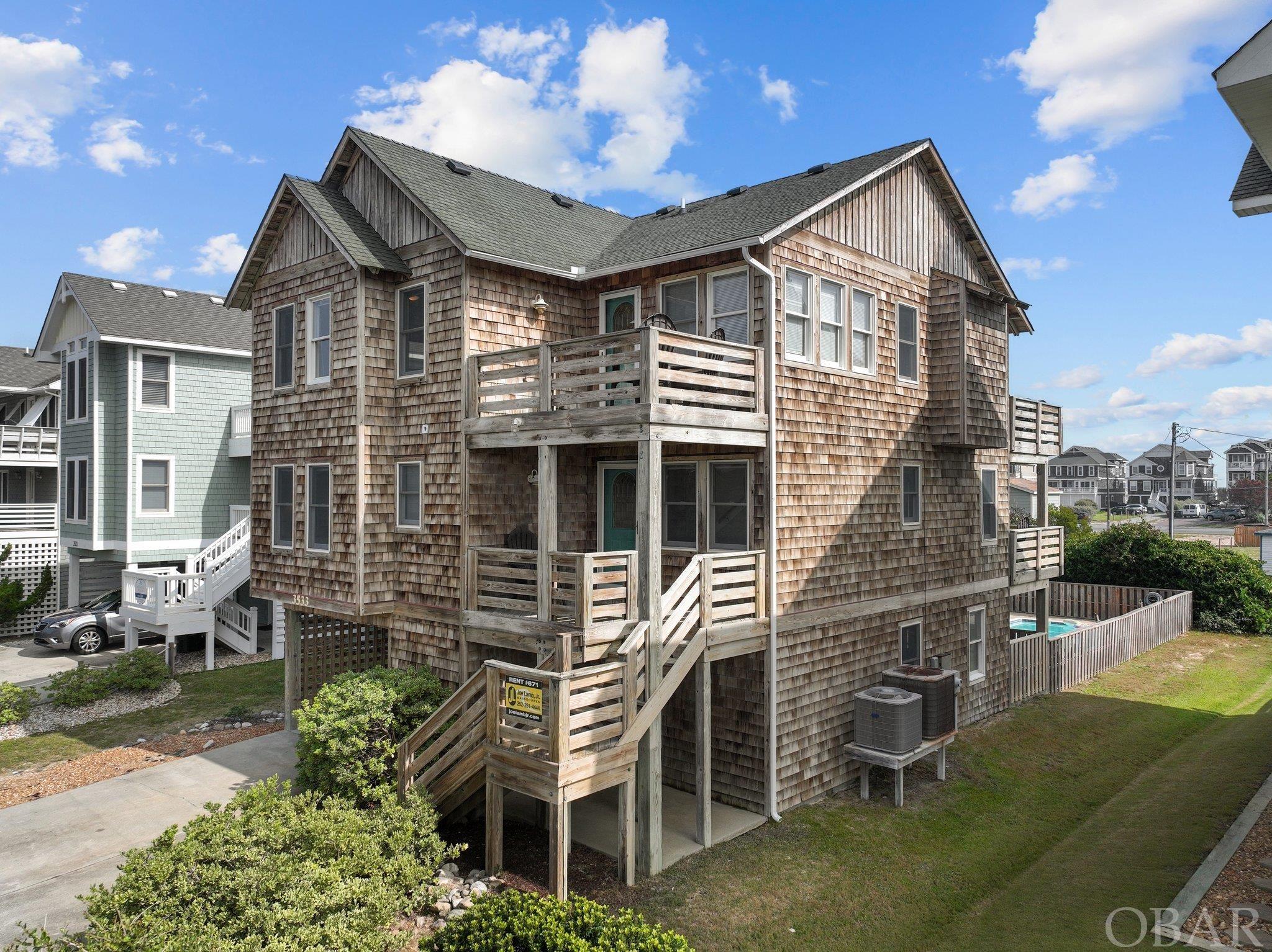 Located in an X Flood Zone, across the street from the entrance to Jockey's Ridge, close to restaurants, shopping and Nags Head Fishing Pier with easy beach access.  Old Nags Head Place provides all the charm of the historic Nags Head architecture while providing the desired amenities of today including a reverse floor plan to showcase the ocean views with an open concept living area, multiple en suite bedrooms, game room, pool and hot tub.