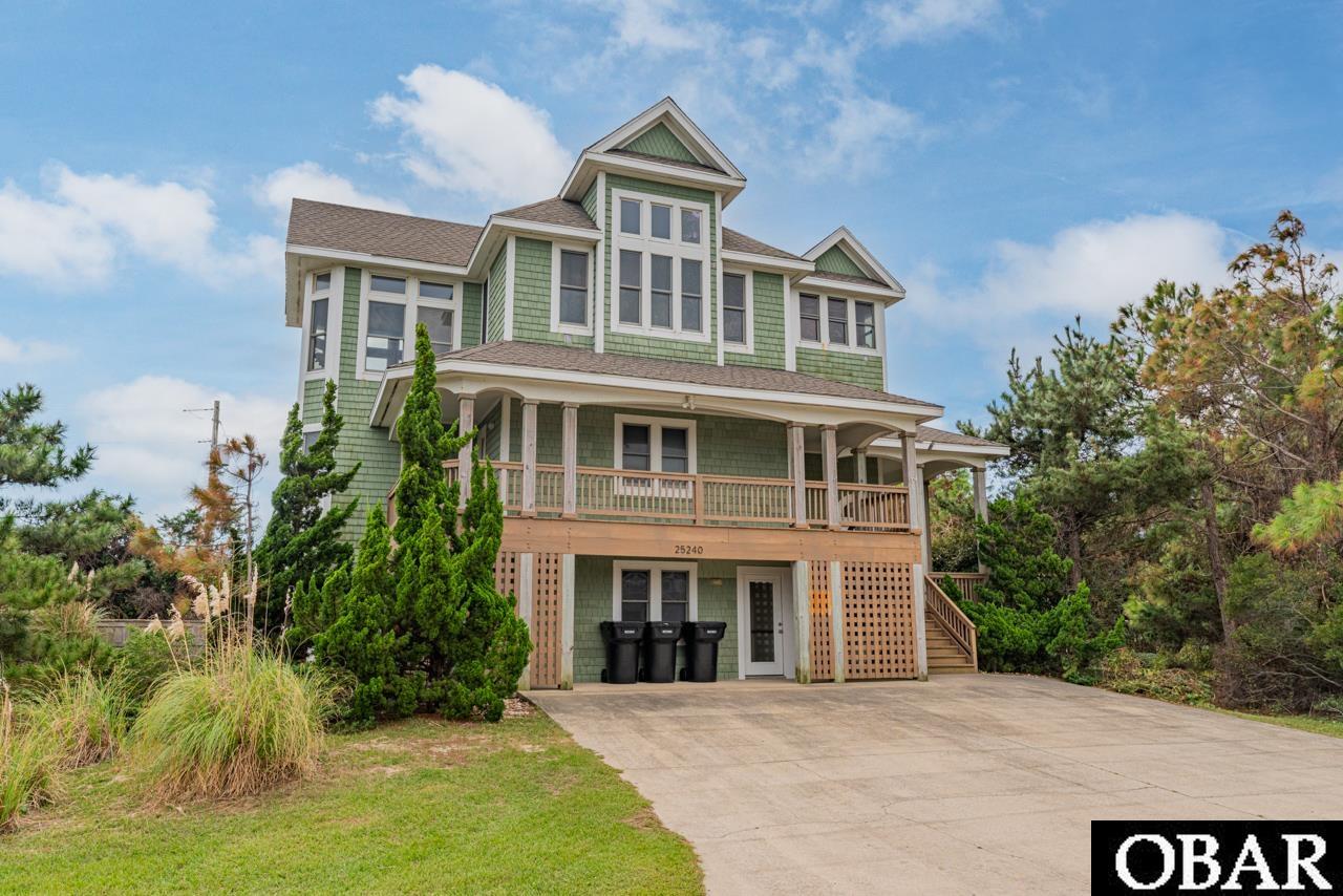 Investor's Dream - 12% ROI: "Island Pines" is more than a vacation home; it's an investment opportunity with a proven track record as a rental machine, boasting a 10% ROI. Nestled in the charming Island Pines subdivision of Waves, this semi-oceanfront stunner sits on a quiet cul-de-sac, mere steps from the beach, yet within minutes of all the dining, shopping, and entertainment the Tri-villages have to offer. This beautifully decorated and exquisitely maintained 8-bedroom home (5 are en-suites), featuring 7 full baths and 1 half bath, offers not only stunning views but also an array of amenities almost too numerous to mention. Let's try to cover them all: TWO outdoor showers, a private heated pool, a hot tub, a beautifully landscaped and partially wooded lot, and a HUGE first-level game room with a kitchenette, wet bar, full-size refrigerator, and microwave. The first floor also boasts TWO en-suites, sundecks, and covered decks, along with a mid-level laundry area for added convenience. Ascend to the upper level and you'll be greeted by an incredible open living space with gorgeous floors, cathedral ceilings, a fireplace, and floor-to-ceiling windows that flood the area with natural light. The fully equipped kitchen features TWO dishwashers and a large island, making it perfect for gatherings. The upper level also includes a en-suite with a jacuzzi tub, providing the ultimate in relaxation. And there's even more to explore! With TWO outdoor showers, a large private lot ideal for gatherings and outdoor games, "Island Pines" offers not just a vacation but a lifestyle. From here, it's a quick two-minute walk to the beach, and a few more minutes will take you to the Rodanthe pier, a deep-water fishing haven. Waves, NC is renowned for kite-surfing and windsurfing, and you're just a quick five-minute walk from lessons and equipment rentals. Don't miss out on the opportunity to own a piece of the Outer Banks that's not only a perfect vacation getaway but also a lucrative investment. Embrace the coastal lifestyle, cherish the ocean views, and indulge in all the recreational amenities this property has to offer. Schedule a viewing today!