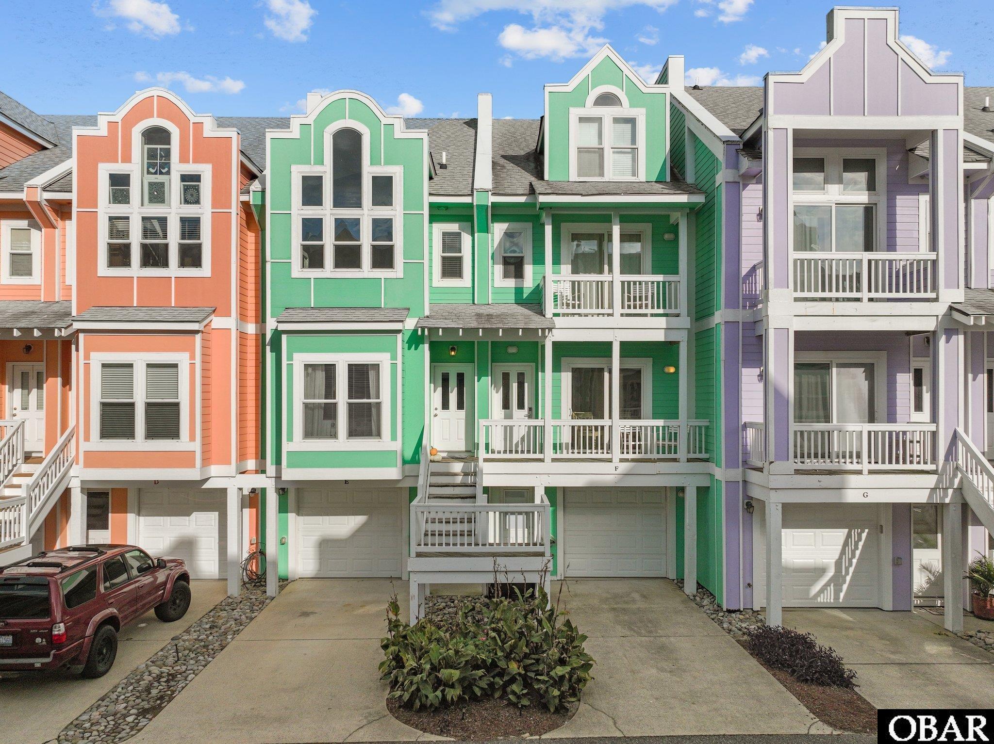 Welcome to this spacious and updated Cambridge Cove Condo in the heart of Kill Devil Hills with a new warrantied HVAC (see associated docs, Sept 2023 new air handler and new heat pump, one of the two heat pumps is original but functioning as intended), new mid level and upper level decking and newly furnished!  This extremely well layed out unit features a lovely great room with high ceilings, a kitchen with granite countertops and bar area, a large dining area with gorgeous windows, and a deck with pergola and large table for outdoor dining!  On the top level you will find a large loft for additional sleeping, or you can use it as a den or office.  On the mid level you will find the main entry into the house, 2 En Suite Bedrooms one with it's own balcony, and the washer and dryer on this level for convenience.  The ground level features a bonus room with its own full bath and patio access which leads out to common greenspace!  The garage is an added bonus to keep all of your beach toys safe! Leave your car in the drive and bike or walk using the sidewalked streets to get to the nicest ocean access in the area with free ample parking if you choose to drive, lifeguarded in season, and a bath house with a convenience store and sandwich shop nearby!  This area is the most central on the Outer Banks so you'll have your pick of year round shops and restaurants, all at your fingertips!  The town of Kill Devil Hills recently added additional sidewalks making the area even more pedestrian and bike friendly!  The Bermuda Bay community has a clubhouse which is close by this unit and has an owner area, a fitness center, and large pool with splash area for kids, and a sound pier!  The HOA includes cable and internet and water is billed twice annually at $210, so a $420 flat fee for the year! CHECK OUT the 6.375% Second Home Loan 15% down with NO PMI ARM loan sheet in associated docs.