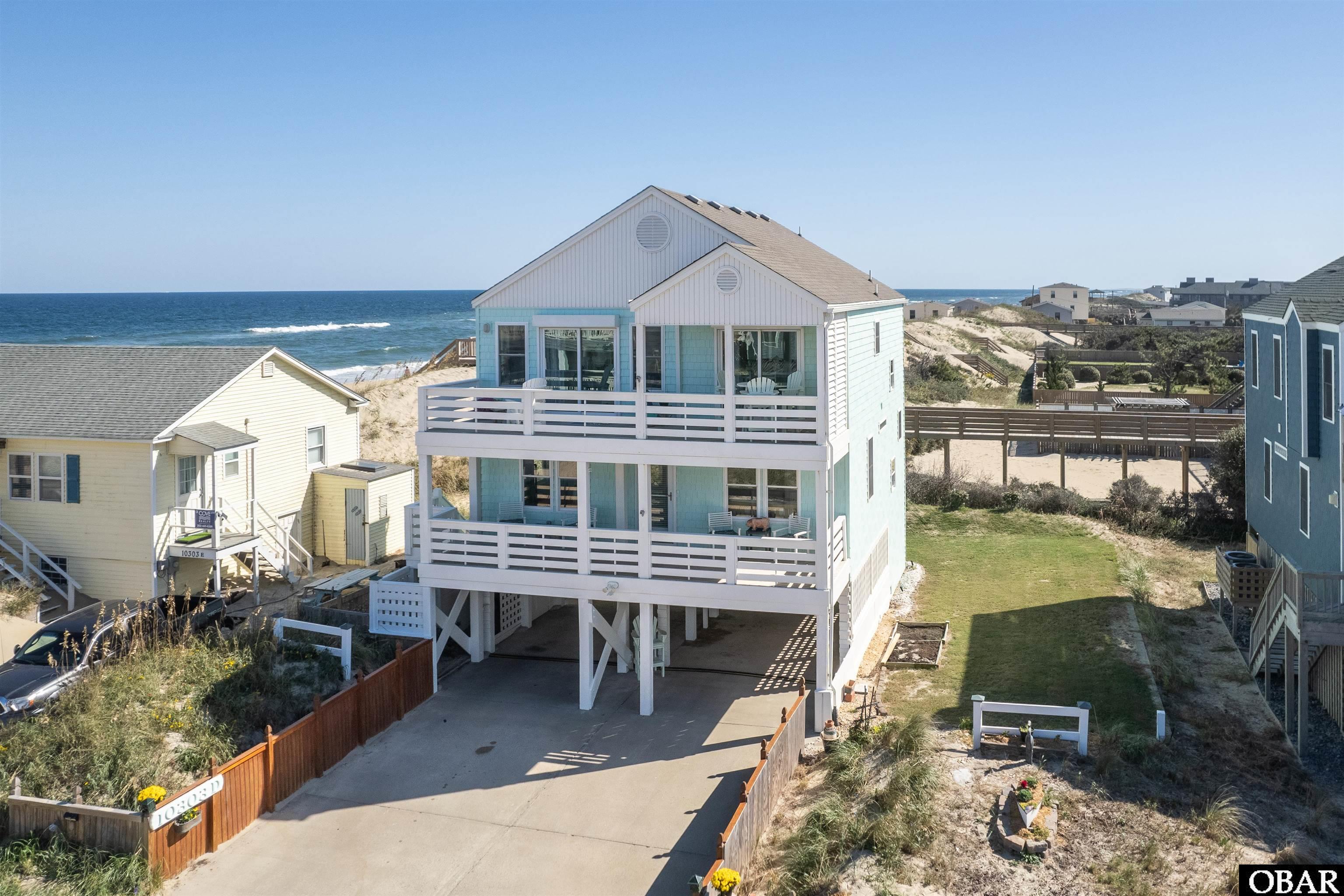 Only Steps to the Beach! This renovated 4BR, 3BA beach house has received meticulous attention from its owners and is turn-key ready.  Designed with an open floorplan, this investment property or second home features a spacious kitchen with roomy island, dining/living areas with cathedral ceiling, gas fireplace with tile surround, upper-level master bedroom, two mid-level guest rooms with jack-and-jill bathroom, a fourth guest room with ensuite bath, utility room, and bi-level decks offering spectacular ocean views.  Property features include NEW interior/exterior paint, NEW luxury vinyl plank flooring throughout, NEW windows, NEW GE stainless appliances, NEW HVAC units with maintenance contract, NEW hot water heater, NEW countertops and tile backsplash, NEW vanities, and NEW lighting and plumbing fixtures.  Exterior features dry entry, outdoor shower, storage closet, NEW retaining walls, NEW landscaping, NEW sod and NEW irrigation system. See associated documents for a complete Improvements List, Survey and Elevation Certificate.  Rental Projections in associated docs.  Only pre-qualified or proof of funds buyers please.