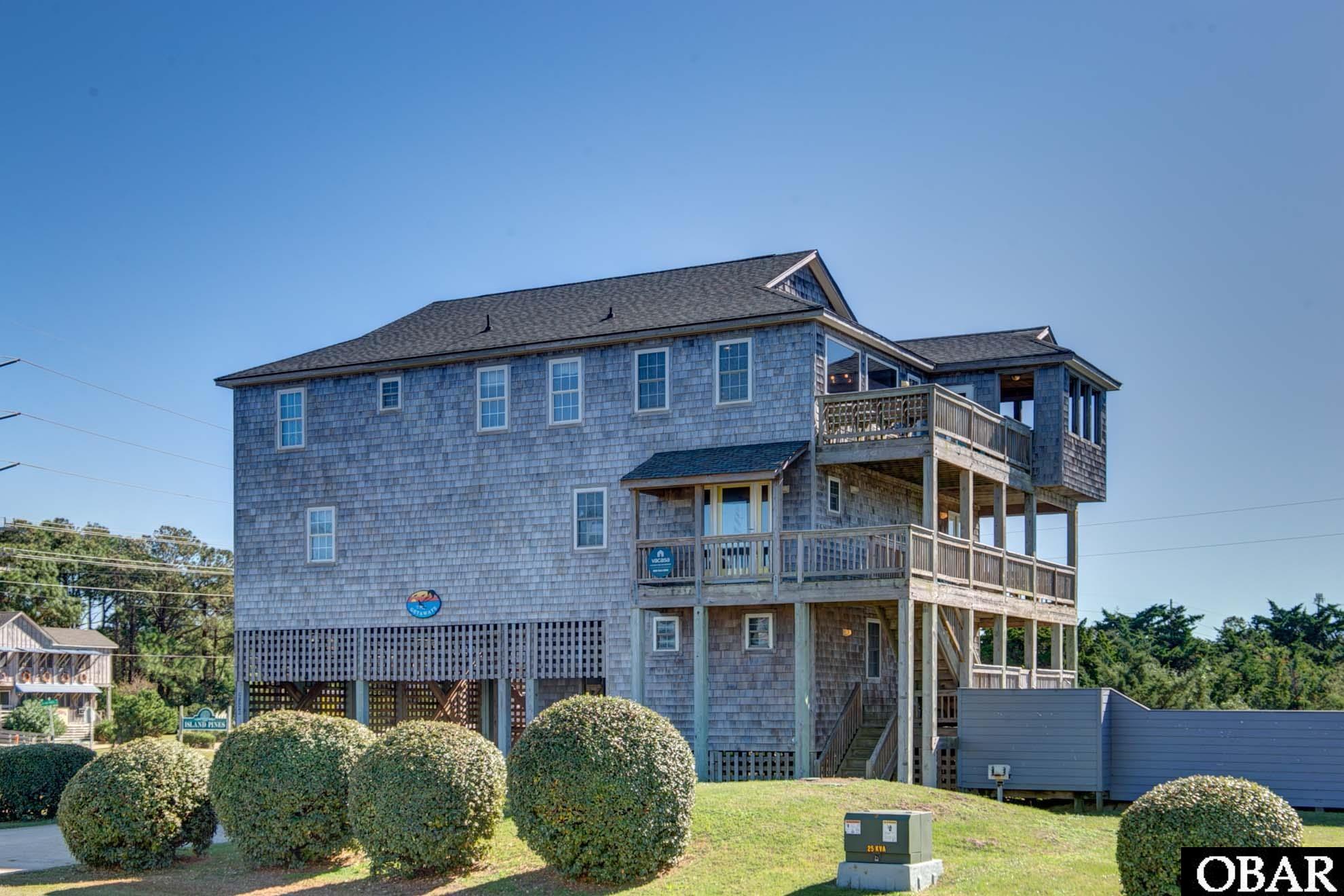 This spacious amenity packed 5 bedroom home has room for everyone!  Located on the soundside in Waves, this home offers stunning sound views and is still just a short walk to the beach. The ground level features a gameroom with air hockey, foosball and TV area, half bath, laundry and deck access to the private pool and hot tub.  The middle level has 4 large bedrooms each with their own recently renovated bathrooms.  The top floor is an open concept layout featuring a spacious renovated kitchen, large dining area, living room, game area with pool table and a private room that could be used as an office, sitting room or bar area. There is also a half bath and master bedroom with a renovated bathroom.  Enjoy beautiful sound views, screened porch and decks. Additional amenties include an elevator to all 3 floors, under house covered parking, outdoor storage and recent renovations to kitchen, bathrooms, flooring and furnishings.