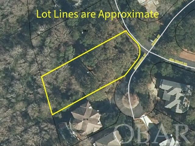 This lovely and partially X-flood zoned soundfront lot is cleared in part, and perfect for your dream home. With a pier and boat lift, this is the perfect opportunity for your own coastal retreat with stunning sunset views over the serene waters of the Currituck Sound.