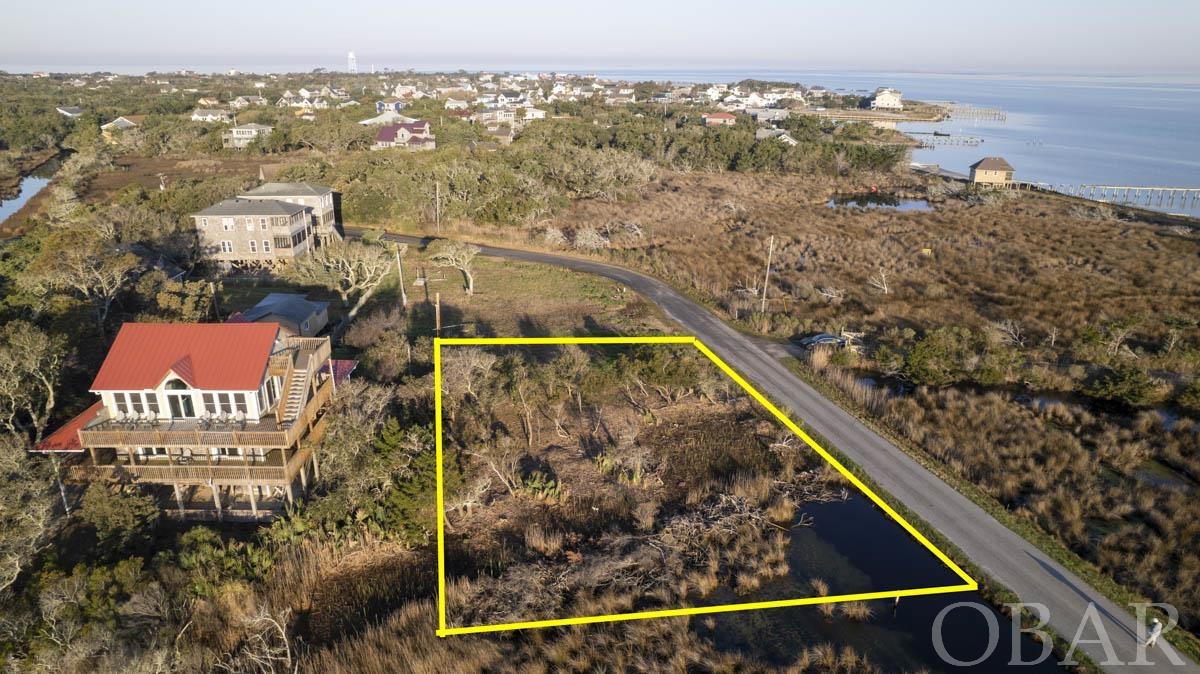 Unique opportunity to own a piece of paradise!  This oversized lot is located off the beaten path yet an easy walk or bike ride to the heart of the village.  Perched on the edge of a salt marsh and across the street from Pamlico Sound abundant views prevail.  This 1/4 acre lot conveys with a 4 bedroom septic permit and a 3 bedroom, 2 bath water meter.  It's location guarantees panoramic, wide open sound views as well as extensive marsh vistas, a birdwatchers paradise.