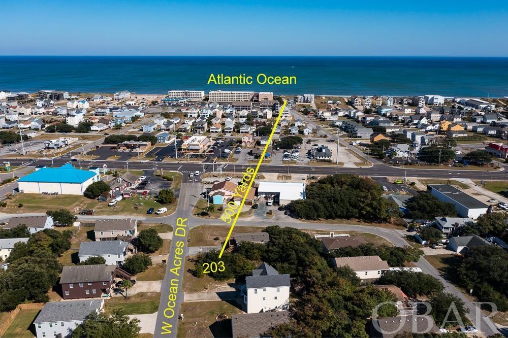 Can't find the house you are looking for?  Then build exactly what your heart desires in the heart of the Outer Banks!  This lot is centrally located between the beach and the sound in an excellent community.  A drone photograph illustrates ocean views at 35 feet.  It is just a short 5-minute walk to the beach and everything else you would want to do such as shopping, dining, watersports and tourist attractions such as The Wright Brothers Monument and Nags Head Woods.  For those wanting a primary residence proximity to schools can't be beat!  Own this property and you will be conveniently close to everything!  With inventory low don't miss the opportunity to lock in your dream home location now!  This lot is not required to hook up to the community sewer system so owners can save big on monthly utilities.