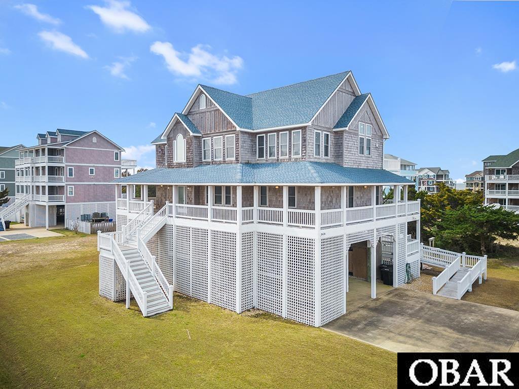 Welcome to this STUNNING home, located in the popular Wind Over Waves subdivision of Salvo! With this excellent location, you'll find yourself by all the amenities a beach town has to offer! Enter into the grand foyer, with ease of access to bottom floor game room & lounge area, w/ full bath & bedroom. Back up to the foyer you have access to the perfect office/study. Down the hall are 4 bedrooms one of which being a true master w/ luxurious ensuite bath. Take the elevator or staircase up to the top floor where you will be greeted with beautiful sound views. Living are is large & open to spacious dining area, kitchen, & sunroom. Top floor also features powder room & main primary suite with WIC, ensuite bath with soaking tub, stand alone shower & dual vanities! All 3 floors have access to the elevator as well as spacious decks. Backyard features in ground pool, fish cleaning station, outdoor shower, hot tub, & separate entry access to the bottom floor game room. Priced to sell! This truly is an incredible investment opportunity!