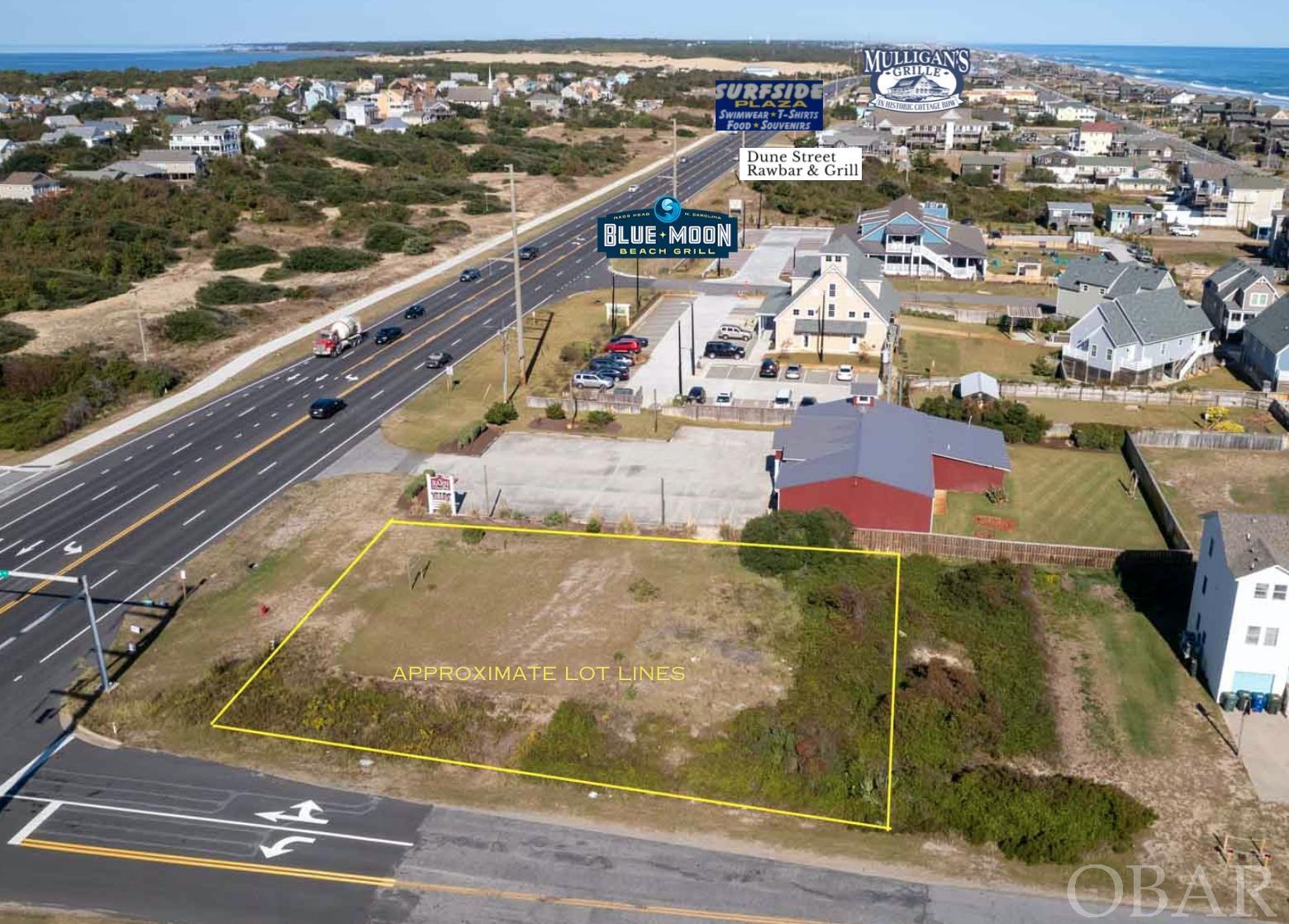 When you look at Real Estate you look at the location.  This corner location just south of Jockey's Ridge, the new Blue Moon, the even site Haven on the Beach.  Just north of the Outer Banks Hospital and the Outer Banks Mall. Surrounded by year round residence this site could support many of the allowed uses.  Owner has done the hard part with one mixed use idea.  Building concept would contain 4 residential condos and two Comercial condos.  Many more uses allowed.