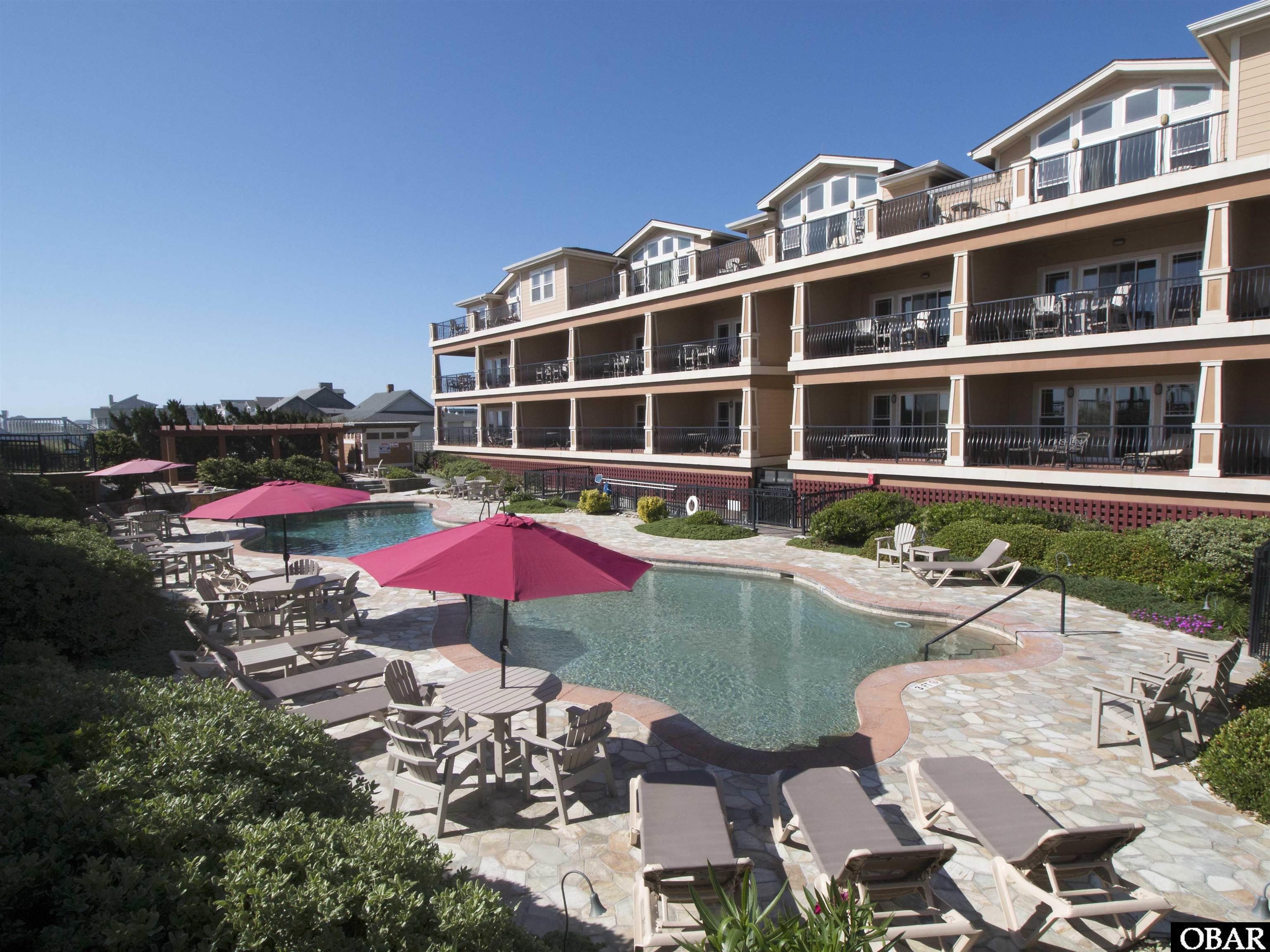The location doesn't get any better than this! Croatan Surf Club is famous for mixing the elegant luxury we all want, with the fun we all wish we could have! Feel like you're vacationing at an all-inclusive resort while enjoying your own personal beach oasis. Expansive outdoor pool with lounge area, indoor pool, gym, and hot tubs with a separate area for the kid's water playground. Topped off with a peaceful ocean view deck and gazebo to gather your favorite people in. All along the best stretch of Kill Devil Hills Beach.  This particular unit is the most desired south-facing condo, as it has an expansive and breathtaking view of the Outer Banks shoreline. Watch sailboats, sea birds, and dolphins from your massive porch. With all the southern exposure, this condo is filled with light. Highlighting the eloquent architectural features. Such as tray and vaulted ceilings in each room. Granite on every surface. Hardwood floors, and custom tiled bathrooms with a jacuzzi bath. If you have high-end taste buds this is the one for you! If that wasn't enough Croatan Surf club condos are so famous for being phenomenal, that they have an incredibly solid income history. Make great money and great memories with your family! This is the one.