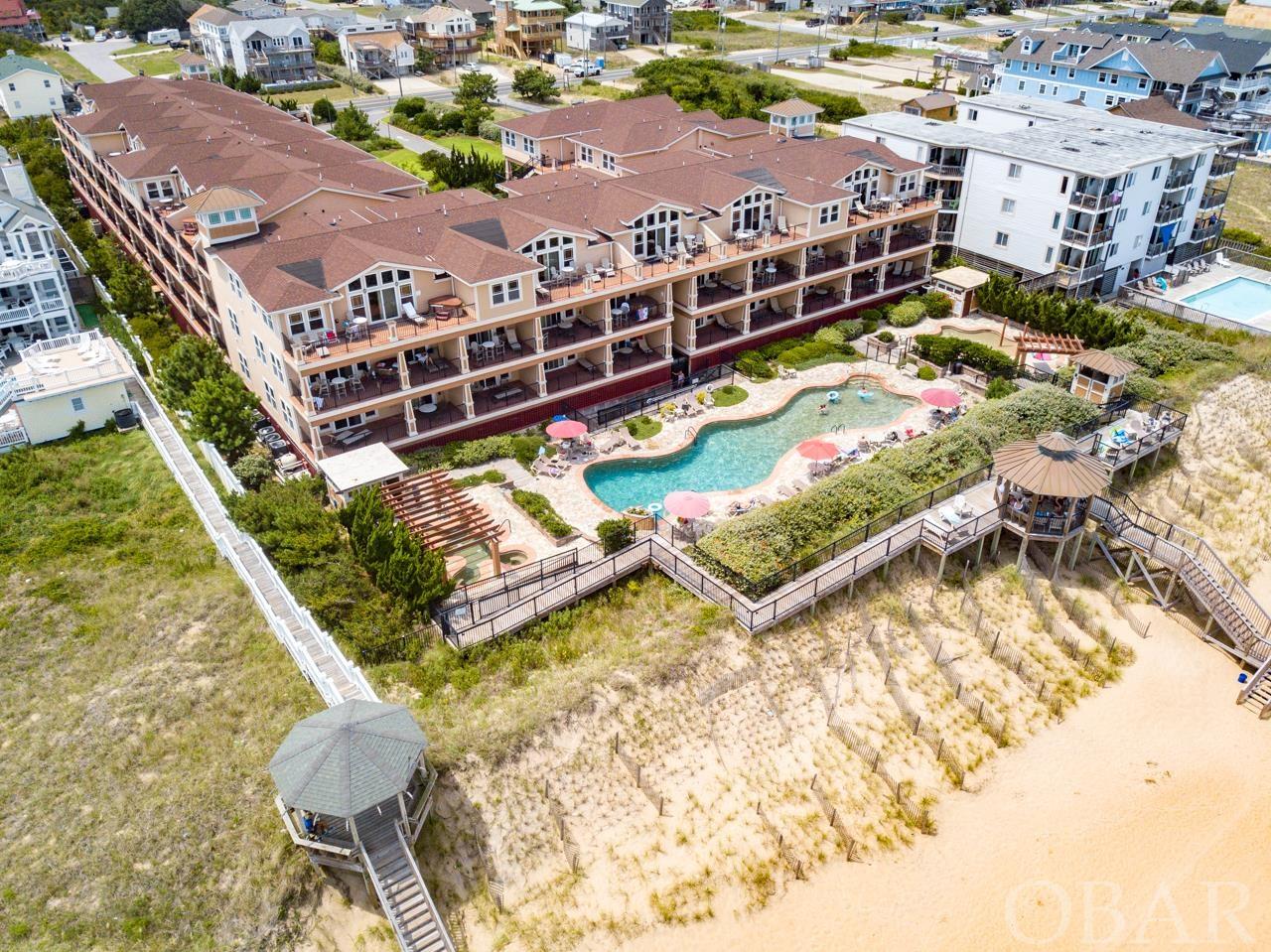 The Croatan Surf Club, the Prestigious Oceanfront Resort Community located on the Beautiful Beaches of the Outer Banks of North Carolina. This first class community boasts all the amenities one could desire for a fabulous beach vacation. Now available located top floor with convenient one level living, this 3 bedroom/3 bath flat has upgraded appointments throughout. Included are hardwood floors, custom tile, granite countertops, electric fireplace and much much more and yes the great ocean views from the large private sun deck overlooking the dunes and the Atlantic Ocean. Exquisitely furnished for ones immediate enjoyment, either as a place to call home at the beach, for the discriminating vacationer or great investment property. The amenities at the Croatan are as a First Class resort should be with a tremendous 84' long custom oceanfront pool, separate children's pool with spay ground, large outdoor hot tub/spa area and dune-top boardwalks with gazebo which all lead down to the sand and waters of the Atlantic Ocean. Also, indoor amenities include an heated pool with hot tub/spa and fitness room which are open year round. Schedule a showing today and see all that the Croatan Surf Club has to offer!!!