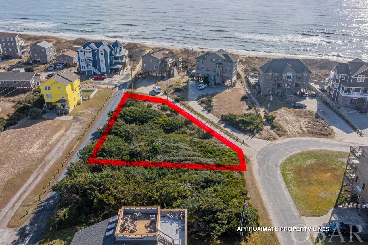 Discover an unparalleled opportunity to build your dream coastal retreat on this semi-oceanfront 11,000 square foot lot, located in the prestigious Hatterasman subdivision in Frisco, NC. With exclusive deeded beach access just steps away, your days can be filled with sun-soaked adventures and serene oceanfront living. This exceptional lot is not only about its proximity to the beach but also offers easy access to Hatteras Island's pristine beaches through Ramp 49, catering to off-road vehicles. The beauty of Frisco extends beyond its oceanfront, with convenient access to the tranquil waters of the Pamlico Sound at Sandy Bay, ideal for exploring and enjoying peaceful sunsets. Additionally, this location is perfectly situated near a variety of restaurants, charming local shops, and grocery stores, ensuring that everyday conveniences are always within easy reach. This property is not just a piece of land; it's a gateway to a lifestyle where the charm of coastal living is blended with the comfort of community amenities. Embrace the chance to create a lifetime of memories in a locale that truly embodies the best of coastal living. Don't miss this exceptional opportunity to own a slice of paradise!