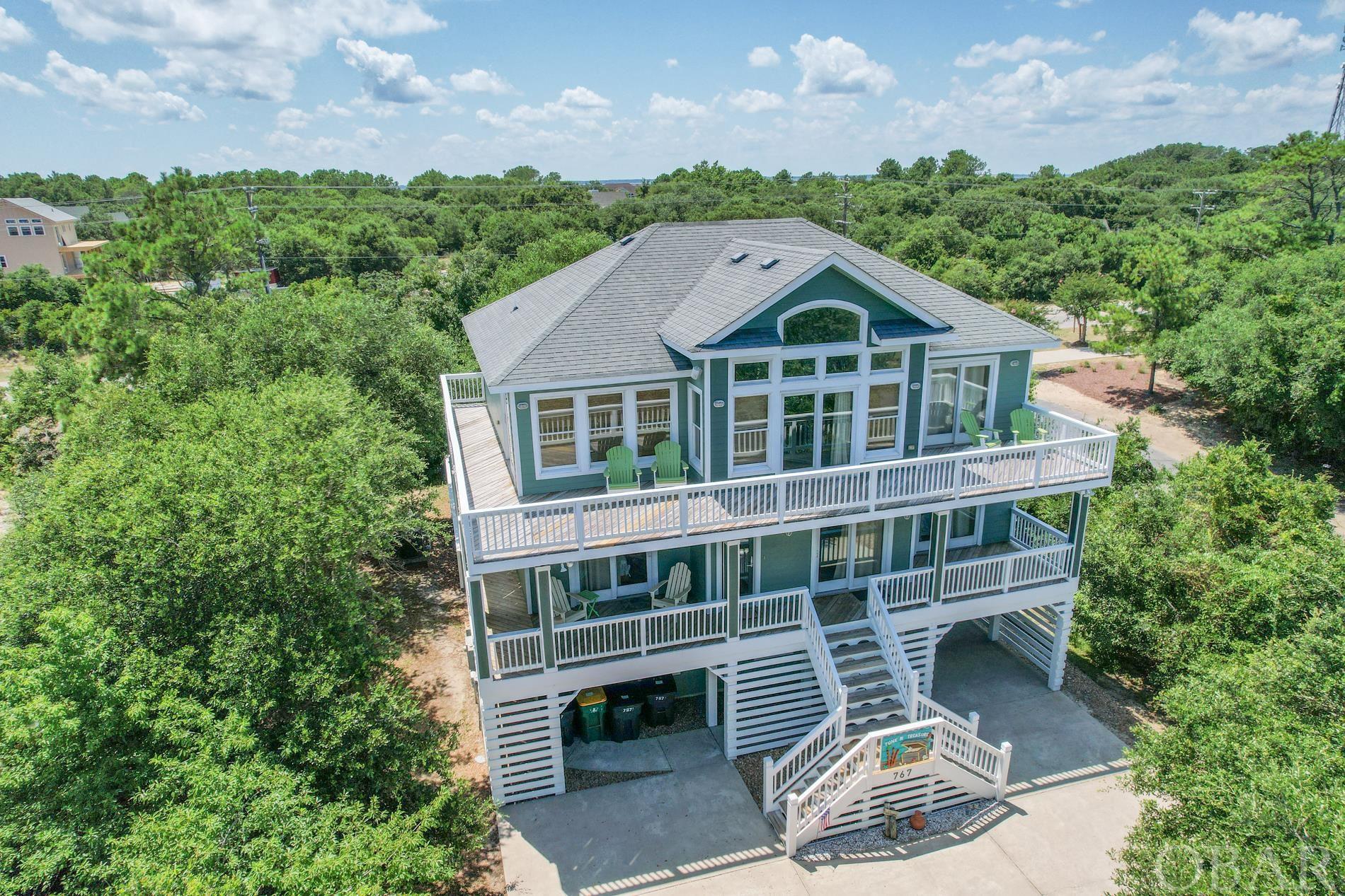 Nestled away on a cul-de-sac w/an extremely thought out floor plan, this 3 story coastal vacation home is a rental powerhouse! Located on the ocean side of Rte 12, its only 3 blocks/.3 mile/6 mins from ocean access. This beauty sleeps 19! Open concept great room w/cathedral ceilings, 4 bedrooms w/ ensuites, 3 addt’l bedrooms & a flex room, 2.5 addt’l baths, heated pool, hot tub, outdoor shower, pool table FREIGHT LIFT, & oversized driveway that can fit up to 10 full sized cars. Newer Lovesac furniture, large dining room table & a fully stocked kitchen w/ 2 dishwashers, 2 refrigerators & deep freezer. Community bike path, shopping & restaurants nearby. Renters keep returning; had over $99K on the books for 2021, almost $66K for 2022, $68K for 2023 & already over $61K for 2024. Be sure to see walk- thru video and 3D virtual tour! Whether a private vacation home for yourself or continued investment rental, you definitely don’t want to miss out on this one!