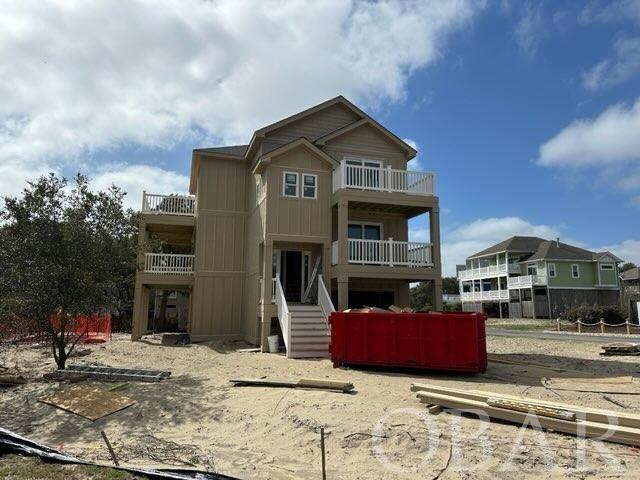 This is a stunning 4-bedroom home and is currently under construction with an expected completion date of 05/31/24. It is situated in the prestigious Monteray Shores community, located on a quiet cul-de-sac and near the beautiful beaches of Corolla, North Carolina, as well as the Currituck Sound.  On the top floor, you will find a kitchen, dining, and living areas with open decks. The mid-level features a master suite and two other bedrooms with a Jack-n-Jill bath. The ground floor will have a fourth bedroom, rec room, full bathroom, garage, and a patio. This home features the latest products and styles, and a SMART home automation package with a front door camera, water sensors on each level, televisions that are hard-wired, and lights that can be controlled from your app. Managing your home from your device is an enormous convenience and offers peace of mind when you are away.  This home is perfect as a second home or investment property and comes with a 1-year Builder's Warranty from the Occupancy Certificate date. Many of the upgraded features include granite countertops, stainless steel appliances, luxury vinyl tile, custom cabinets, private fenced-in pool, situated on a beautifully landscaped lot. Alternatively, guests can enjoy time at the Monteray Shores community pool. Monteray Shores has plenty to offer, including kayaking, crabbing, paddleboarding, and breathtaking sunsets from the two community piers.  If you are looking for affordable new construction in Corolla, this is it!