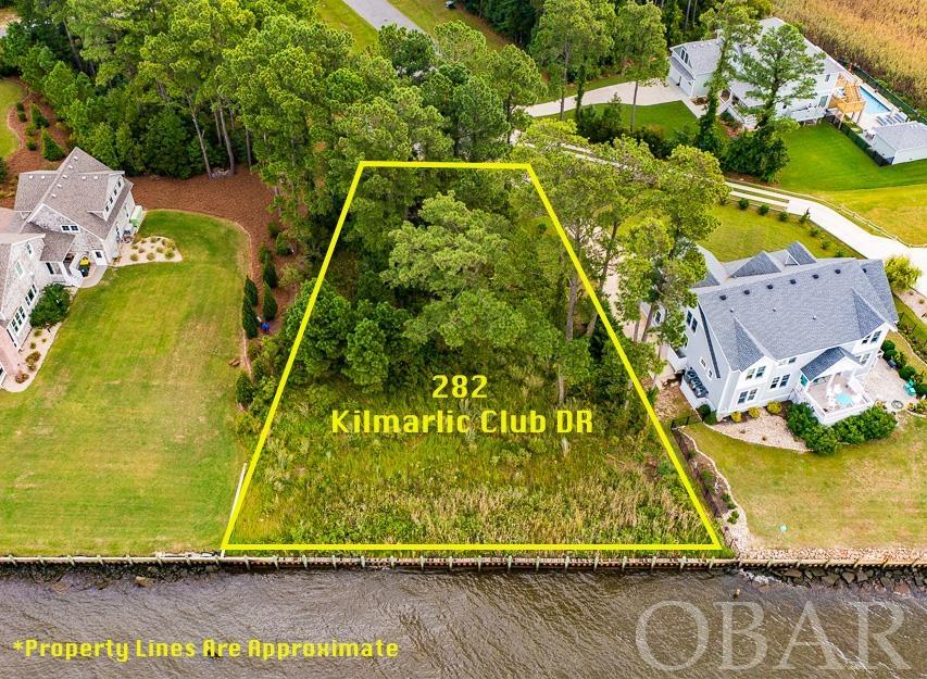 WOW FACTOR!  Bring your plans and start building your dream home on this amazing 136 ft sound frontage lot, in the beautiful Kilmarlic Club golf community.  That's right, you can have it all within your own community, a sound-front beach, golf, swimming and tennis!  This lot is surrounded by some of the most beautiful homes on the Albemarle Sound!  Only five miles to the Outer Banks and even more close to a water park with huge slides and rides!  This lot is already bulkheaded and partially cleared making it a true value.  Beauty, relaxation and outdoor fun await, act now to avoid any regrets!