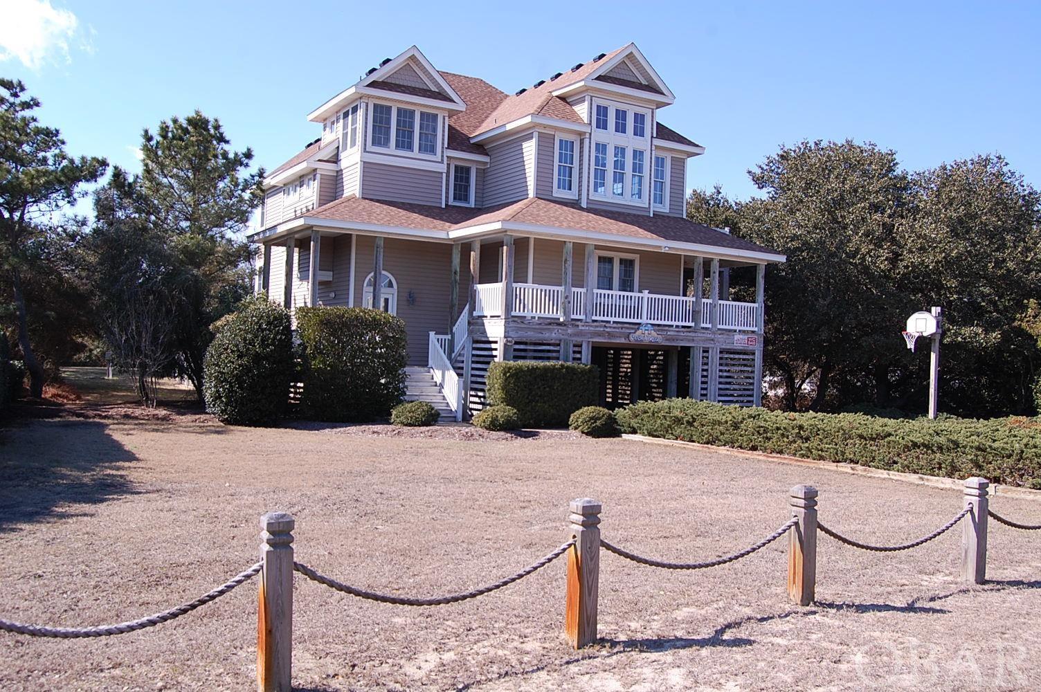 This custom-built home, located in the prestigious Whalehead Club in Corolla, just minutes to the beach. Offers direct beach access via walking path, located on corner lot, with ocean views. Two gas fireplaces, lots of decks, ships watch, 13x28 pool, large well equipped kitchen, spacious bedrooms, landscaping with irrigation. The outdoor area features large private pool, outdoor table perfect for enjoying meals hot off the grill. Conveniently located near world-class golf, dining, shopping and entertainment. This home was used as a personal get-away vs. maximizing rental income. They would blocked any rental bookings until the last week of May, and also reserved time in the summer for family use. This property has it all! Perfect for second home, investment property, or primary residence.