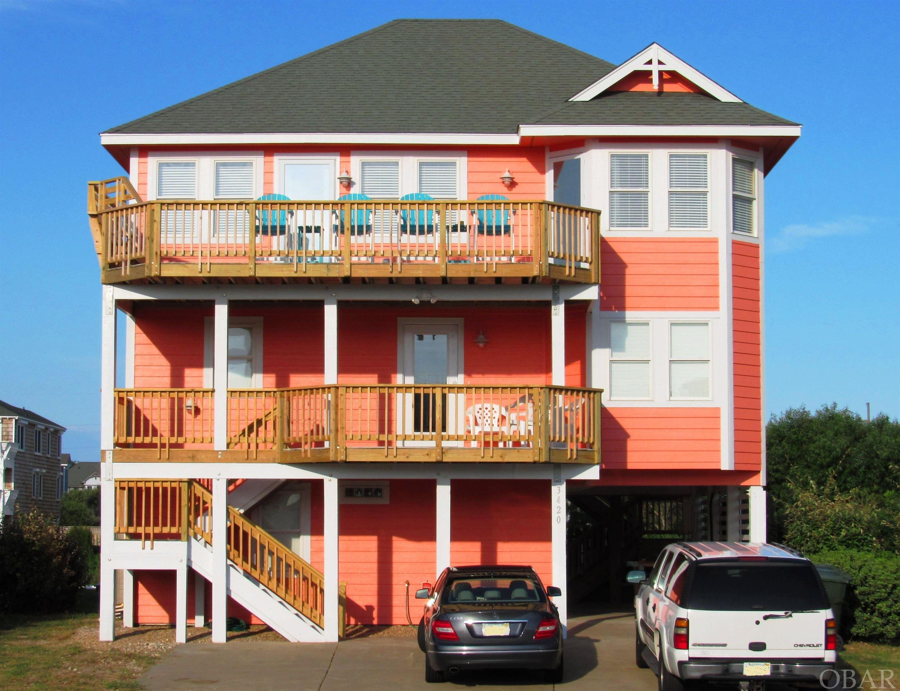 This Semi-Oceanfront home in Nags Head is Just South of the Nags Head Fishing Pier. Beautiful Ocean Views from the spacious Top Level Deck! Deeded Private Beach Access plus Public Beach Access. This Beautiful Home has 5 bedrooms and 4 full baths. The ground floor has a Game Room with pool table and sitting area with 1 bedroom and 1 bathroom. The Mid Level Floor has 3 bedrooms and 2 full baths with a den, laundry closet, and wet bar and has direct access to both the front and rear mid-level decks. The Top Floor has a large living room, huge dining area, and a spacious kitchen. Also on the Top Floor is the master bedroom with its own full bathroom. The private pool, hot tub and recently upgraded front and rear decks maximize outdoor enjoyment of the home. This standout semi-oceanfront home is a gem! Sold fully furnished.