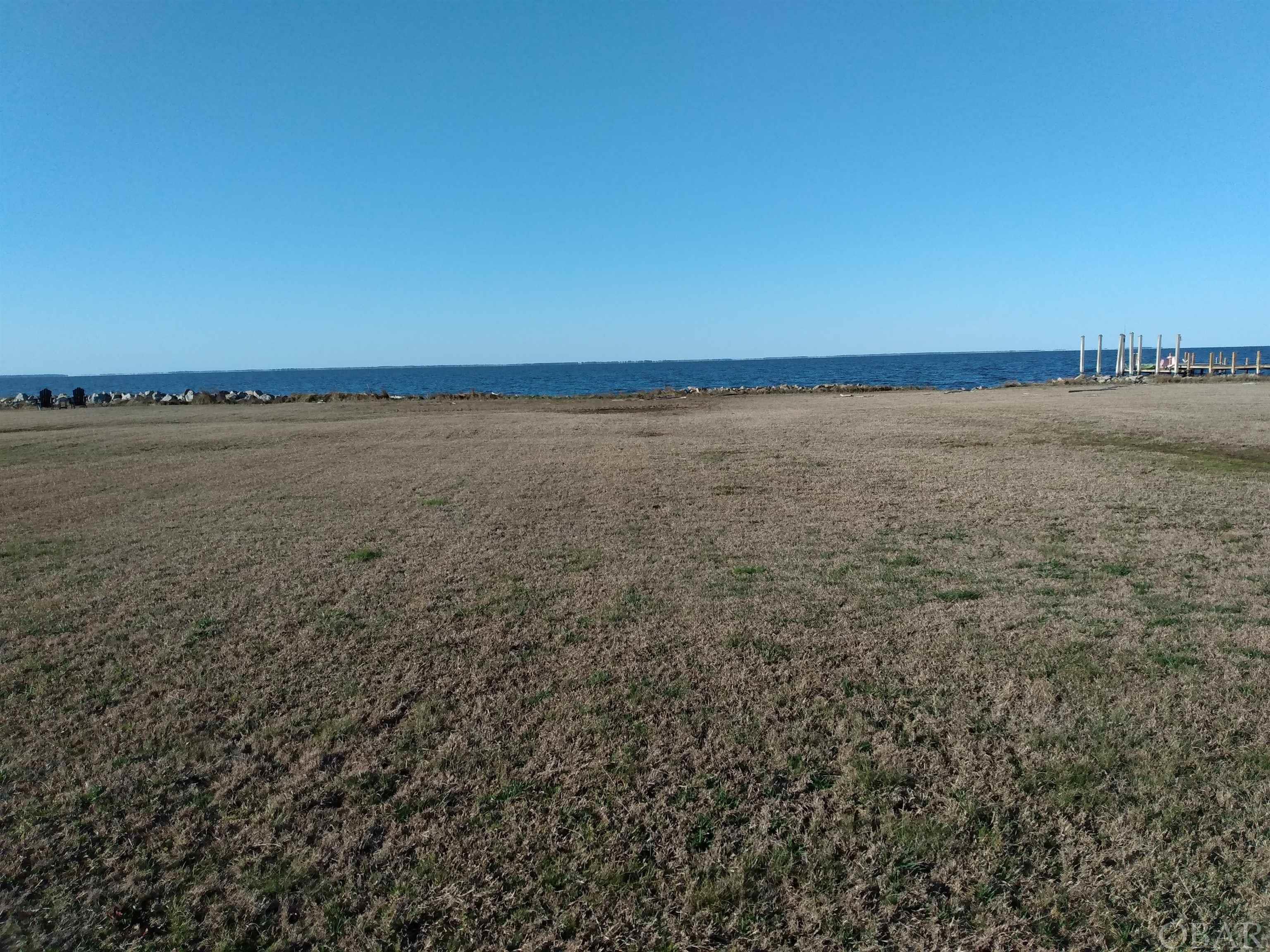 Enjoy spectacular water views and gorgeous sunsets from this waterfront lot on the Albemarle Sound! It has the rip rap shoreline stabilization structure and underground utilities. Septic system permit available. As this lot is not a part of the HOA there are no restrictions associated with this lot! To enhance your access to the sound you could possibly build a pier, dock and boat lift in the water. This property has the potential to meet all of your enjoyment and watersports needs! Just 5 miles north of Columbia, NC and within an hour to the NC Outer Banks! Offered at $89,500.