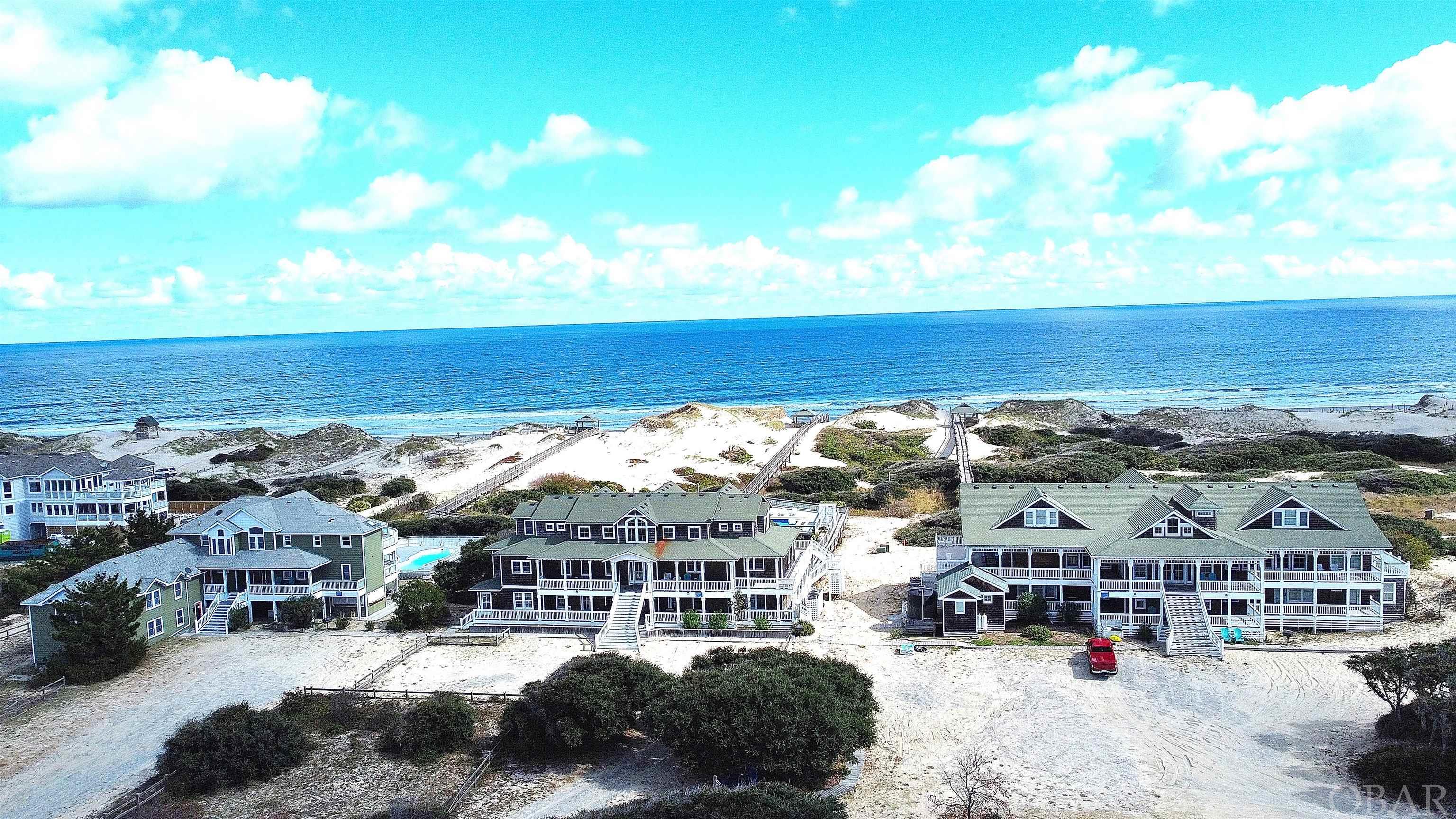 Looking for a picturesque beach estate that is a strong income producer? 2022 and 2023 rentals totaled $2,450,000. This sprawling oceanfront compound known as “The Three Authors” boasts 3 mansions with a total of 45 bedrooms, 37 baths, and 6 half baths. They are situated on over 10 acres of oceanfront property. The property is exquisite, unique, and unforgettable. There are multiple pool areas, gourmet kitchens, gaming areas, theatre rooms, elevators, and wet bars. You have Gigabit Fiber Optic Internet to keep you connected and a Reverse Osmosis Water treatment system for superior quality water.  These three magnificent homes can be used for a family get-together, corporate retreats, weddings, or a secluded getaway to the beach. These homes are quite spectacular with no shortage of luxe details. These properties have an excellent return on invest.  The “Three Authors” is located in the northern end of the Outer Banks on over 10 acres of oceanfront property. The northern section of the Outer Banks is undisturbed shorelines with no commercial development. There are no paved roads. You drive 2 miles on the beach past a North Carolina Coastal Reserve & National Estuarine Research Reserve to get to the properties. They have a private entrance crossing the dunes servicing all three homes. The peaceful and serene setting of these homes which are located in the 4-wheel drive area of the Outer Banks which is a favorite destination of visitors. This area consists of beaches, dunes, a wild horse sanctuary, maritime forests, and the ancestors of Colonial Spanish Mustangs are roaming free. Sit on one of the many decks enjoying a view of the ocean and watch the Spanish Mustangs roam throughout the property or watch the dolphins swim by in the ocean.  The homes in this luxurious retreat were named after Mark Twain, Ernest Hemingway, and F. Scott Fitzgerald.    1) Mark Twain - 18 bedrooms, 15 full and 2 half baths, almost 11,000 square feet, 3.64 acres, 2023 property taxes were $12,505.51. 2) Hemingway - 14 bedrooms, 13 full and 2 half baths, almost 8000 square feet, 3.57 acres, 2023 property taxes were $8,941.41. 3) Fitzgerald - 13 bedrooms, 9 full and 2 half baths, over 6000 square feet, 3.54 acres, 2023 property taxes were $7,695.42.