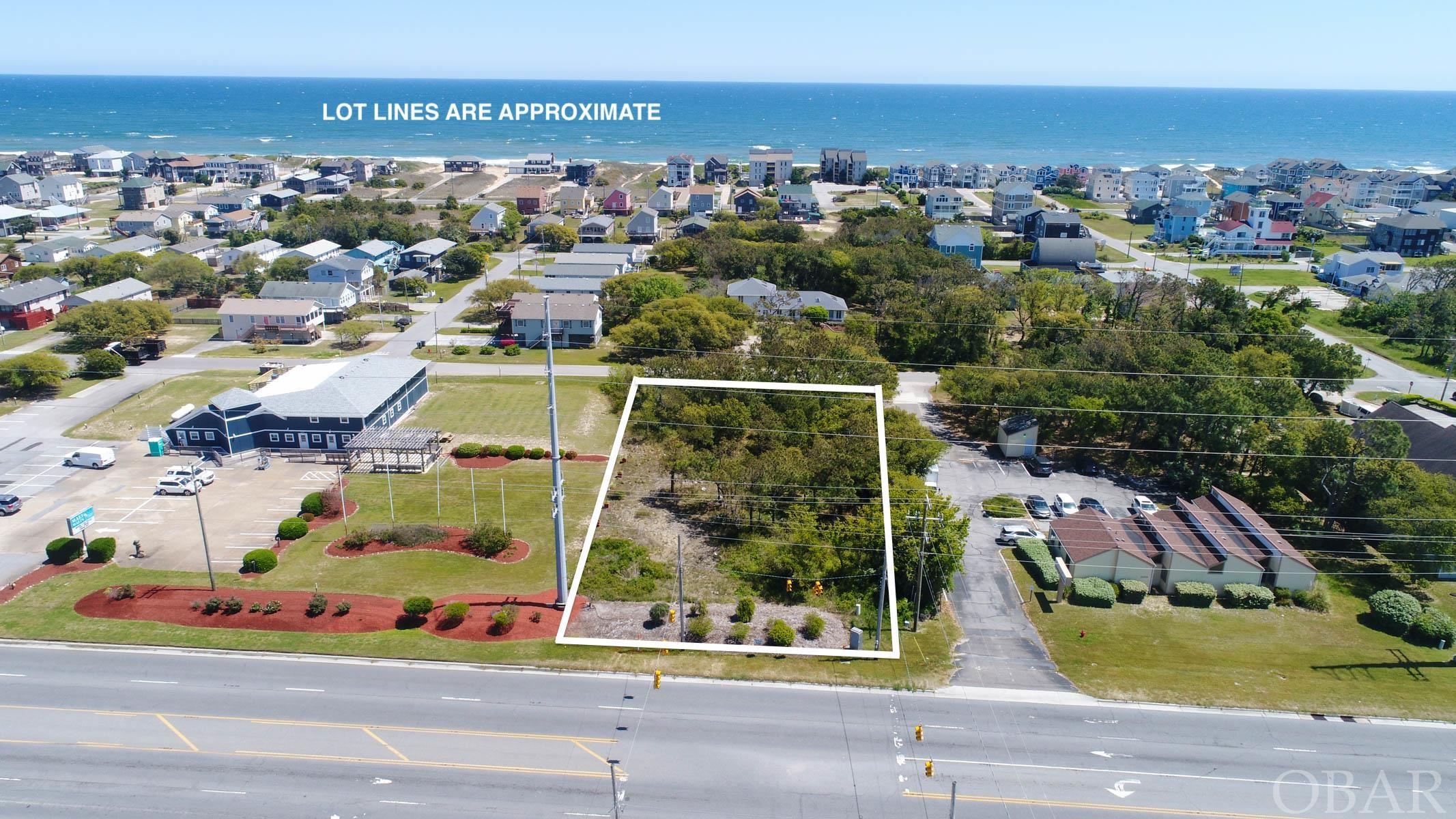 Nags Head Commercial Opportunity!  100 feet of HWY 158 Road Frontage.  Prime location in Nags Head across the street from TW's, TJ Maxx and Staples!   Excellent visibility and location.  The possibility does exist that the current stop light may be modified to have full stop light access.  Letter on file from NC DOT.  Another great feature of this property is that it also fronts Wrightsville Ave on the east side of the property potentially giving it dual access and plenty of options for the new owner.  This is a fantastic opportunity to own commercial property at an affordable price in the heart of Nags Head!
