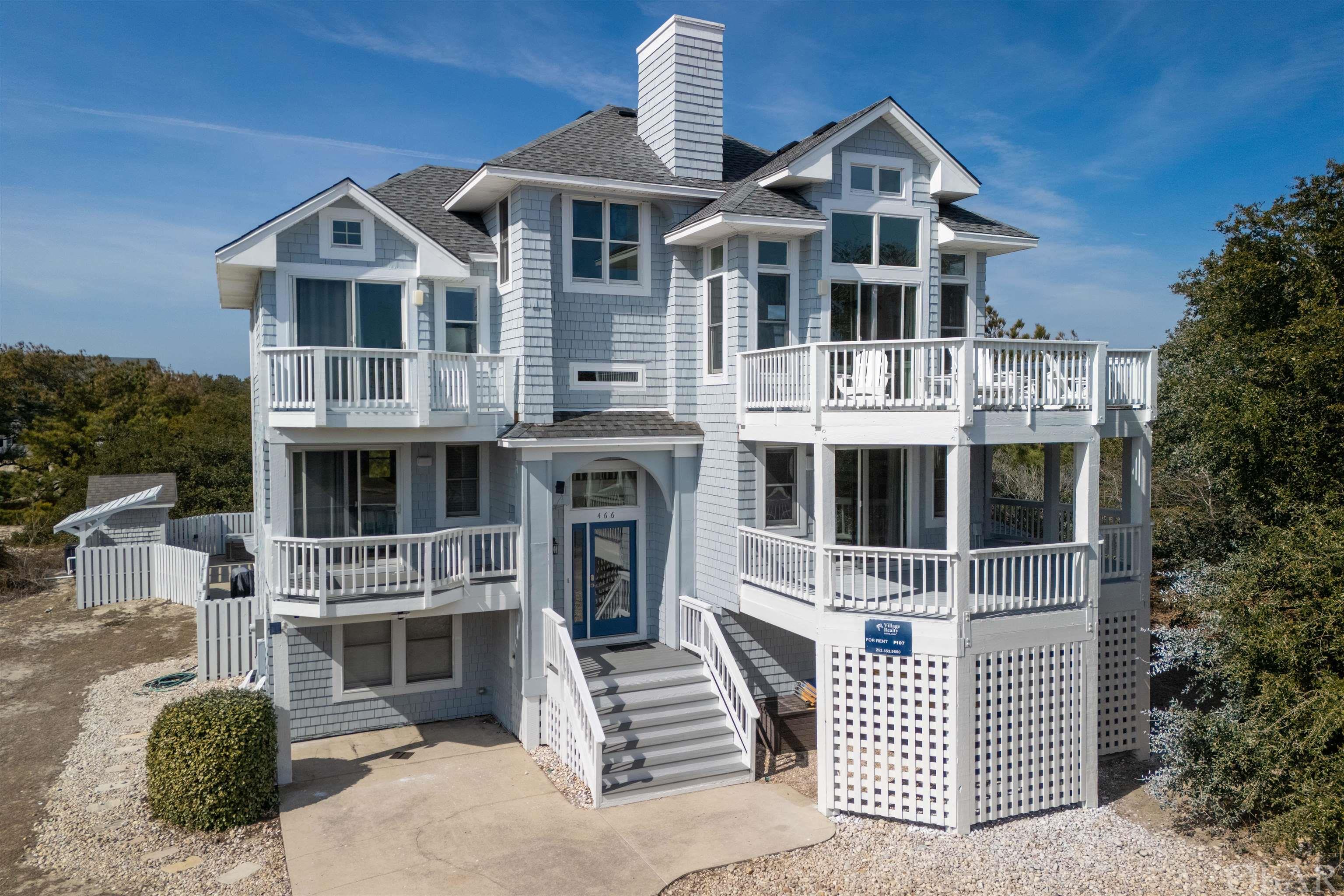 Absolutely captivating, this prestigious Pine Island home with 8 bedrooms and 7 full, 2 half baths is a coastal haven just steps from the beach. Luxurious vinyl plank flooring welcomes you, while the top floor’s open plan and abundant windows offer breathtaking views. The chef’s kitchen features double dishwashers and ovens, complemented by a ships watch and new top-floor decking. Six en suite bedrooms ensure comfort, and the game room with a kitchenette, pool table, and Pac-Man provides endless entertainment. Outside, a saltwater pool, hot tub, and oasis beckon, complemented by a cabana bathroom and outdoor shower. Meticulously maintained, this gem in Pine Island grants exclusive access to pools, tennis, and more. Embrace coastal luxury in the premier neighborhood of Corolla.