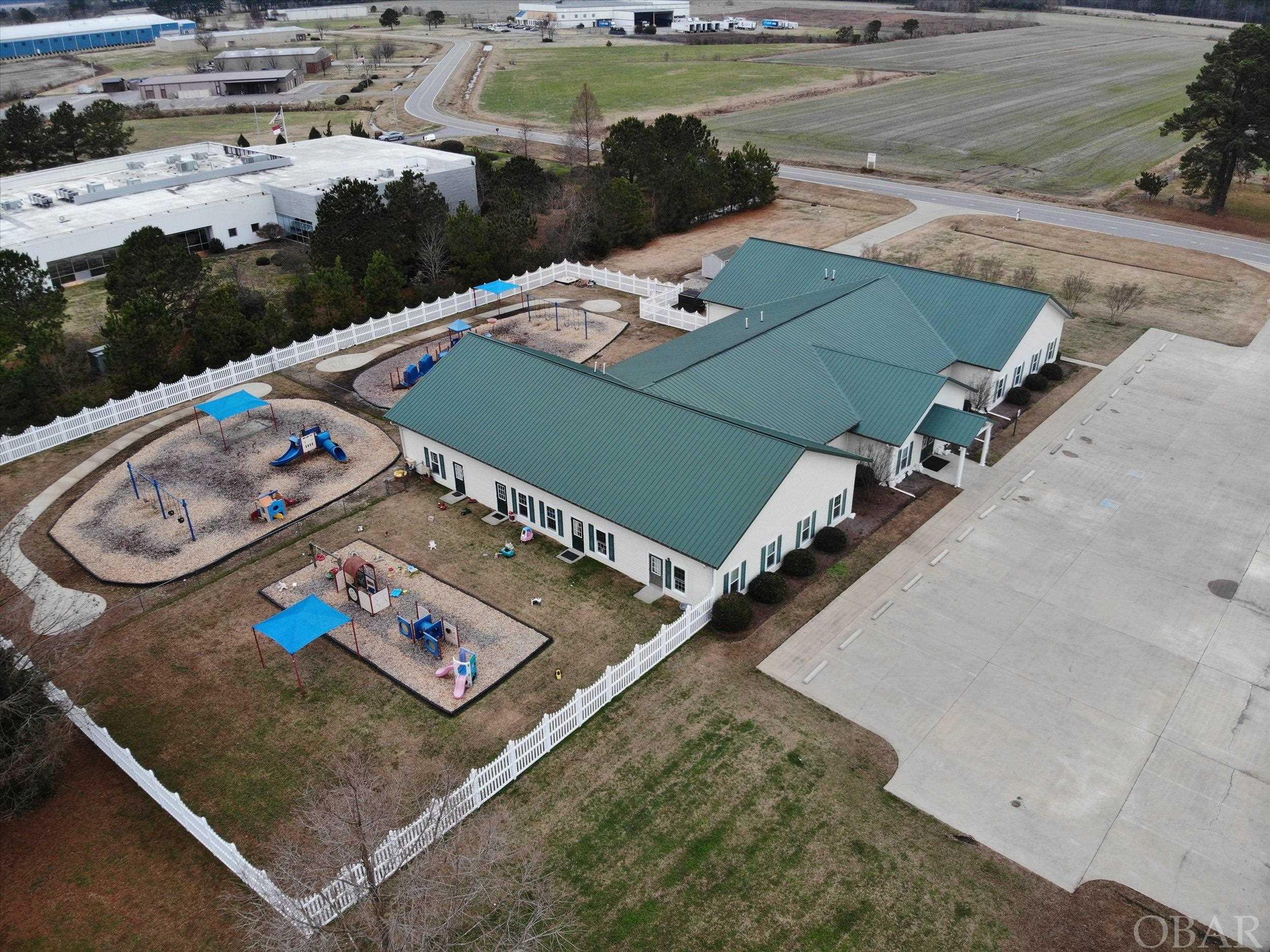 The EC community still seems to have a need for the current configuration and property use as a daycare/academy.  However, the interior has an existing commercial kitchen, several expansive open areas, and offices making a customized buildout a great economic alternative to new construction.  This 10,400 SF building is located on +/-2.7 acres in the Pasquotank Commerce Park, a 300-acre industrial business park only 32 South of the Port of VA (POV) and just off US 17 Bypass.  This is the choice location for enjoying the economic benefits of NC such as lower cost of living compared to Southeastern VA communities, lower corporate tax rates, lower property tax rates, and the charm of the historic downtown River City with breweries, wine bar and fantastic restaurants and shops.  Natural Gas is connected expanding other business use possibilities.  Don't miss this great investment and business opportunity!