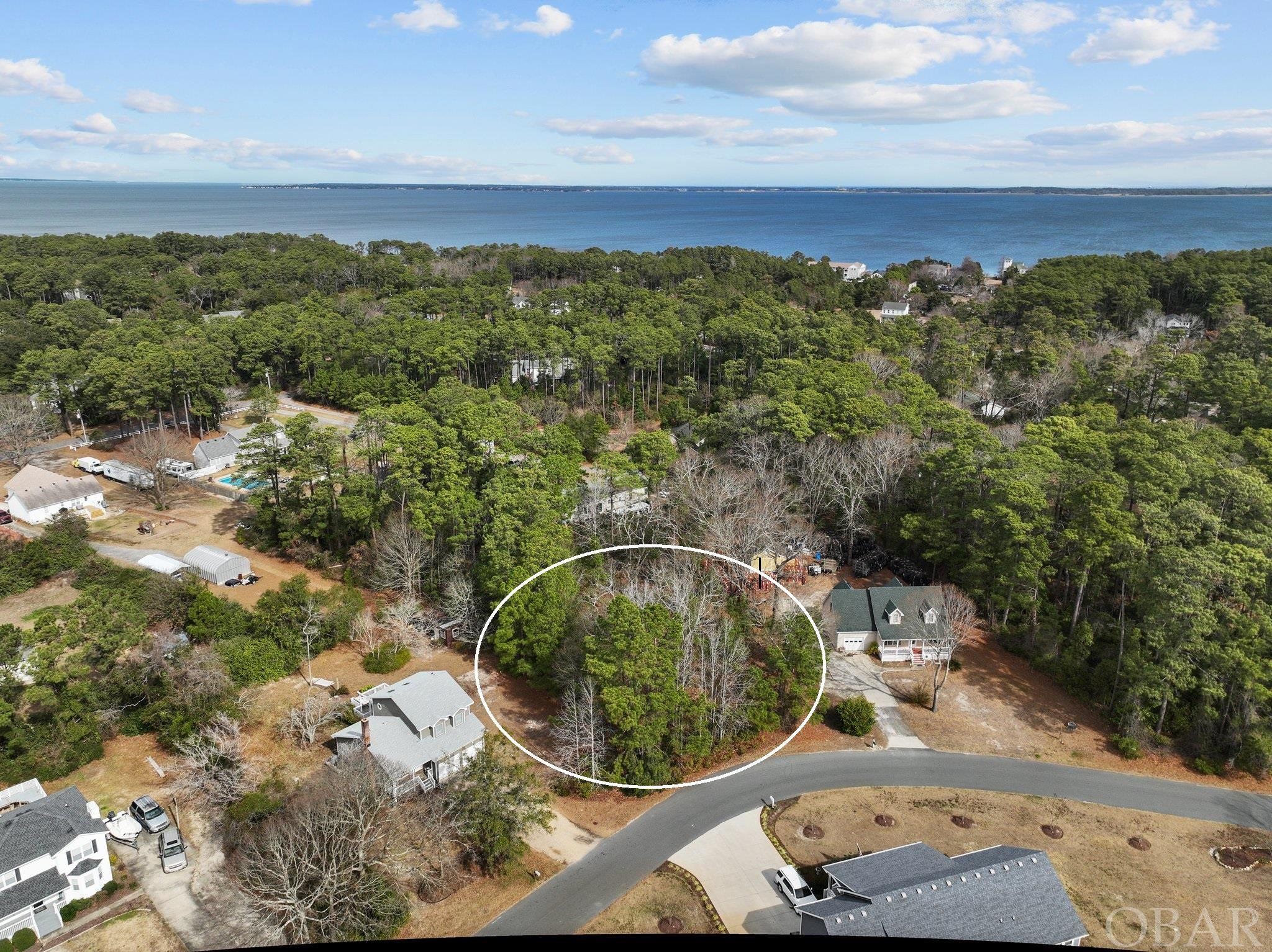 Design your own authentic home in the north end of Manteo.  Blend modern living with the raw nature of the Outer Banks.  Given the 22,000 square foot lot, ample room exists for both a stunning home and lush gardens.  Enjoy all of Manteo's hidden treasures!