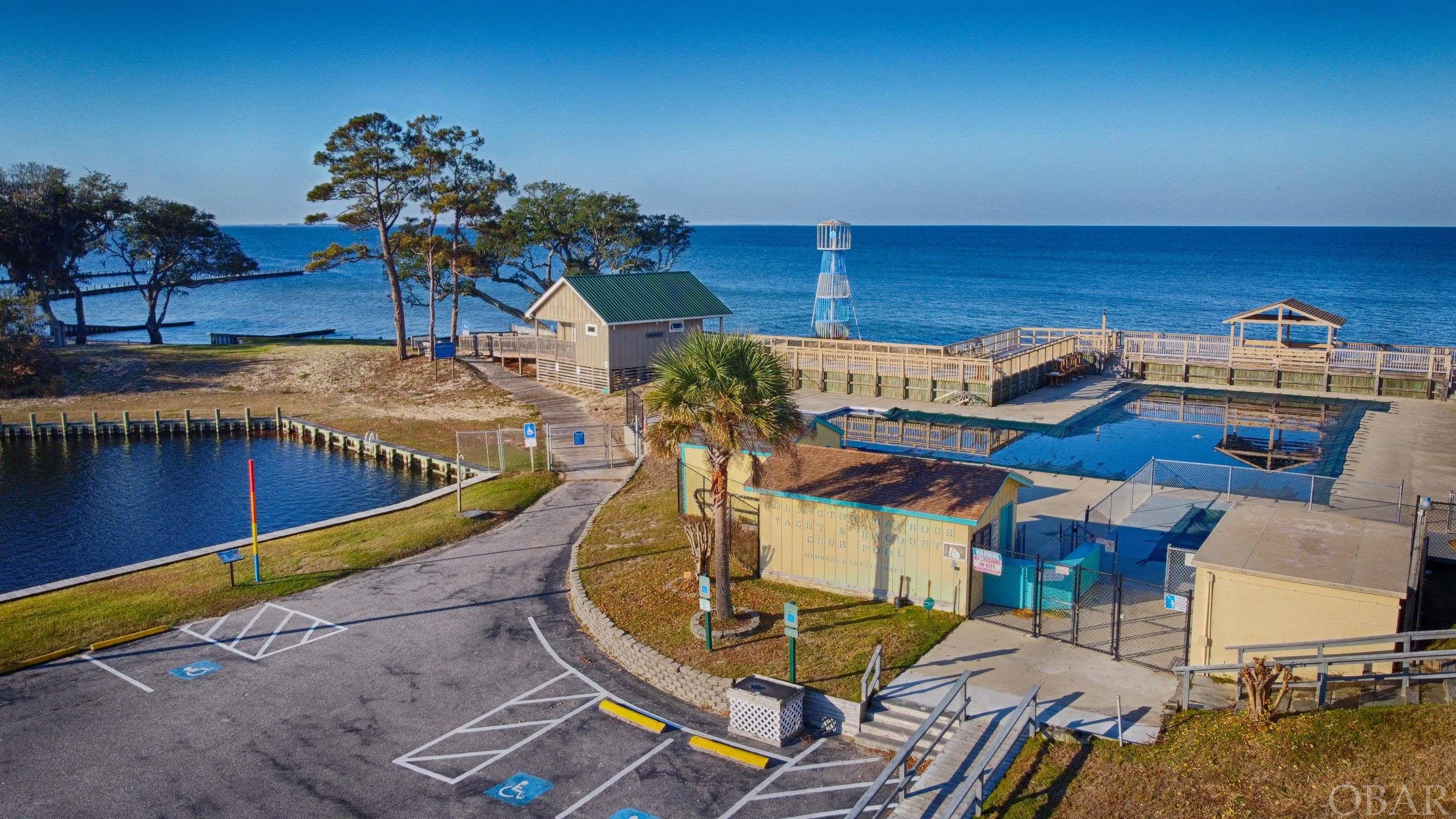 Large community pool with soundfront beach and bathhouse.