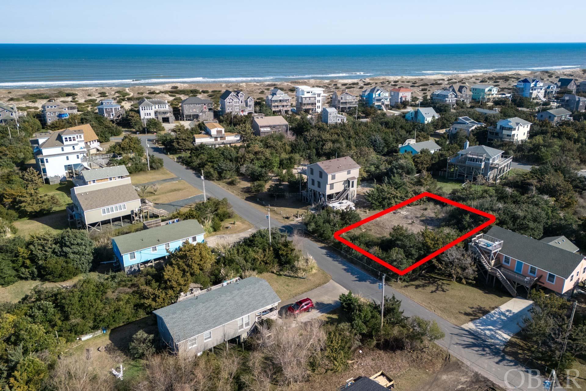 Discover the unparalleled opportunity to build your dream home on this prime piece of land nestled in the heart of the prestigious Hatteras Colony in Salvo. This exceptional property offers direct beach access, ensuring your days are filled with sand, surf, and sun, while sound access across the street in the Wind Over Waves subdivision promises serene water views and activities. Remarkably, this lot comes free of HOA fees and its located in the "shaded X" flood zone, where flood insurance is not required, alongside the convenience of a prepaid water tap fee and a four bedroom septic permit easing the initial steps towards construction. Situated near Real Watersports, the epicenter of kiteboarding, and the Salvo Day Use Area, with its picnic-friendly spaces, shallow waters, and sound side access, this lot is perfectly positioned for both leisure and adventure. The proximity to a multi-use sidewalk path that stretches across the entire Tri-Villages, along with easy access to all the shopping, dining, and entertainment the Outer Banks have to offer. Additionally, the lot's stable protective dune and wide beaches provide a naturally beautiful and serene backdrop for your future home. Whether you envision a permanent residence, a vacation retreat, or an investment property, this vacant lot in Salvo's Hatteras Colony offers the perfect canvas for your coastal lifestyle dreams. Don't let this opportunity pass you by!