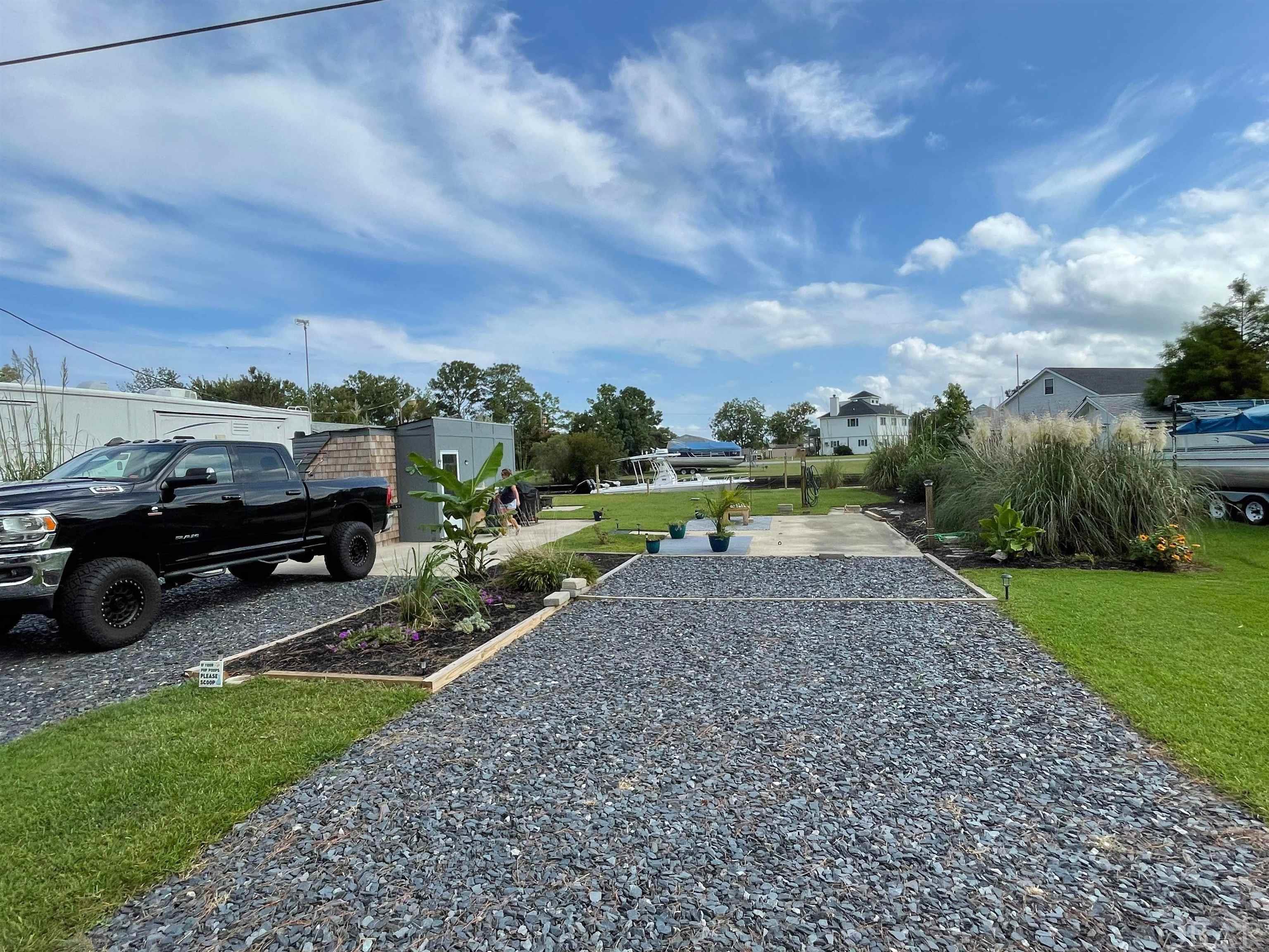 Two waterfront lots with direct access to the sound. 60' of water frontage on a wide canal.  Only 15 minutes to the beach and approximately 40 minutes to the Virginia Line.  Municipal water and sewer are in place.