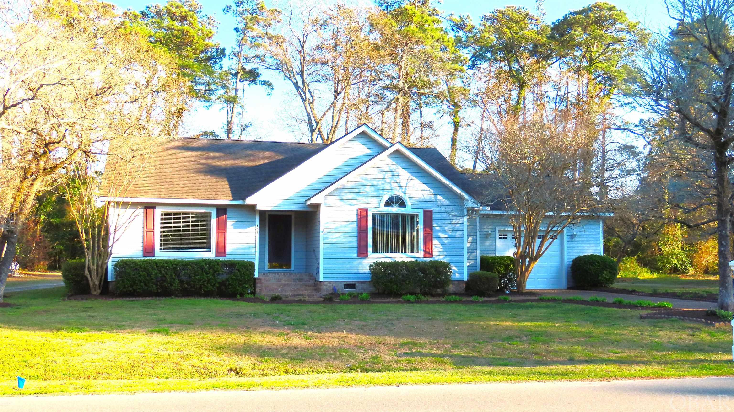 Established Roanoke Island neighborhood of Brakewood! Light-filled 3-bedroom/2-bathroom home is accessed by few stairs front & back and exudes warmth with a welcoming open floor plan accentuated by Oak Floors stretching through the foyer & hall.  MANY RECENT UPGRADES! Including ALL NEW PLUMBING PIPES! Also NEW Interior Paint (NO Popcorn!), Bath Vanities & Fixtures, Interior Doors & Hardware, Bedroom Blinds, A/C Vents, Kitchen Pulls, Appliances AND MORE. Picture windows in front rooms. Renewed vitality with newer carpets professionally cleaned, wood floors polished, ceramic tiles steam-cleaned. Outdoor enthusiasts will love the large garage with a NEW 10ft-wide door, a great two-level patio-style deck off the rear dining space, complete with protective Gutters along the roofline. Freshly tended and mulched Flower Beds grace the perimeter, adding to the home's curb appeal--now coming into bloom! Large Garden has an array of veggies. A 20x16 enclosed WORKSHOP with Power & Water, complemented by a separate 20x12 Open Shed, offers endless possibilities. With low-maintenance vinyl siding and 14-year old roof this home offers peace of mind. The Ruud exterior HVAC compressor and Rheem interior air handler, both manufactured in 2016, ensure efficient climate control, while the 2018-manufactured water heater provides ample hot water for all your needs. Don't miss the opportunity to make this gem your own!