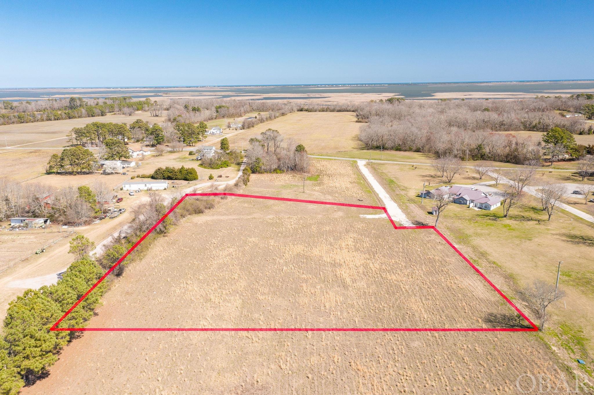 4 Acres, cleared in Lower Currituck. Looking for a spot to lay a few roots down and let them grow? Look no further. With four (4) acres to spread out, this space has so many possibilities. With no HOA and no HOA fees (or HOA restrictions), you have the freedom to make this property your own private oasis. Centrally located within Currituck yet just a very short drive to the Outer Banks. Grocery shopping is located within miles but you can still enjoy a slower paced lifestyle on the backroads.