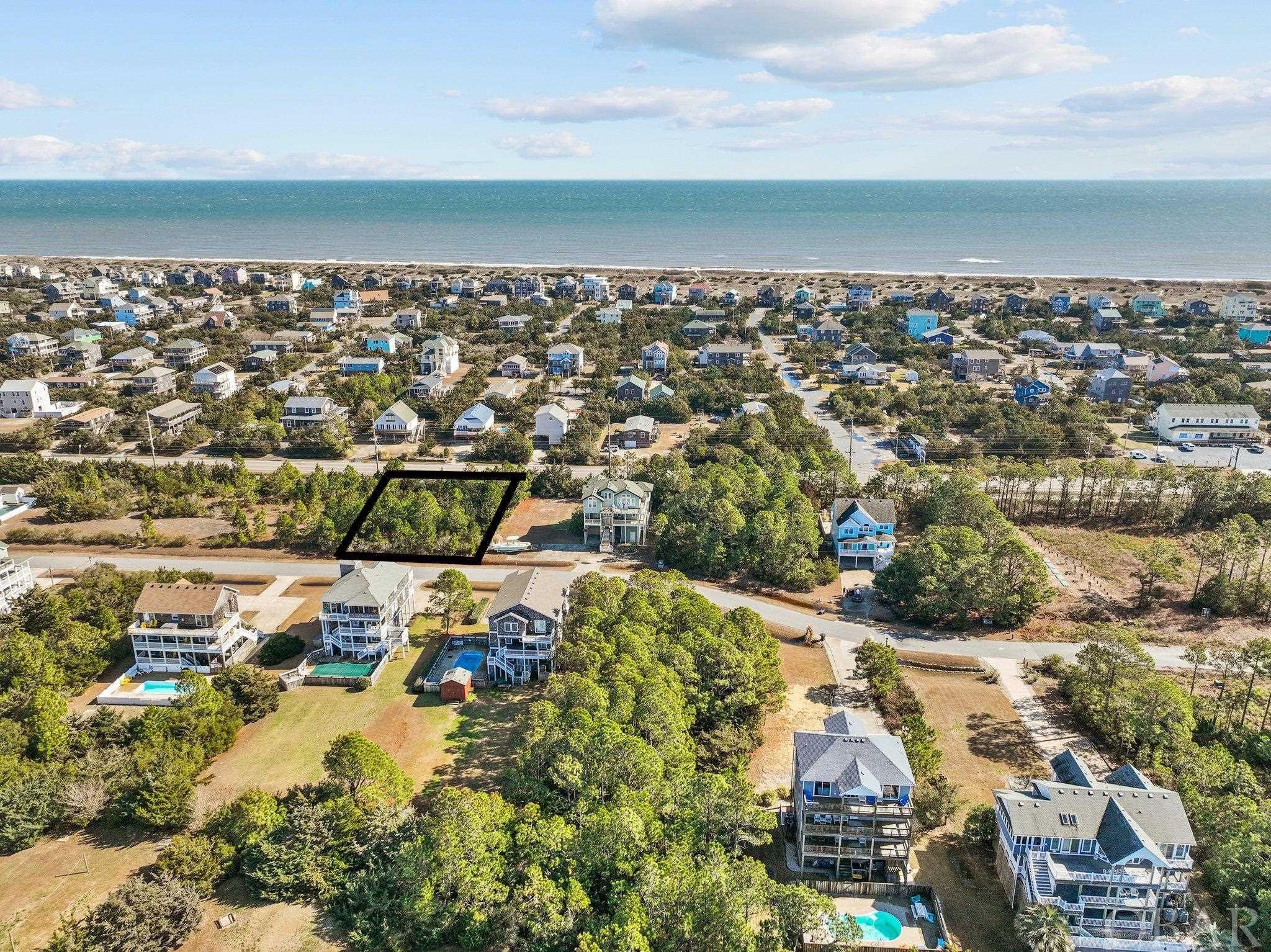 Great vacant lot in the private soundfront Wind Over Waves subdivision. Enjoy the boat ramp and dock for easy access to Pamlico Sound, along with deeded beach access. Build your dream home and enjoy the kiteboarding, restaurants, beach and all the other activities! DISCLAIMER