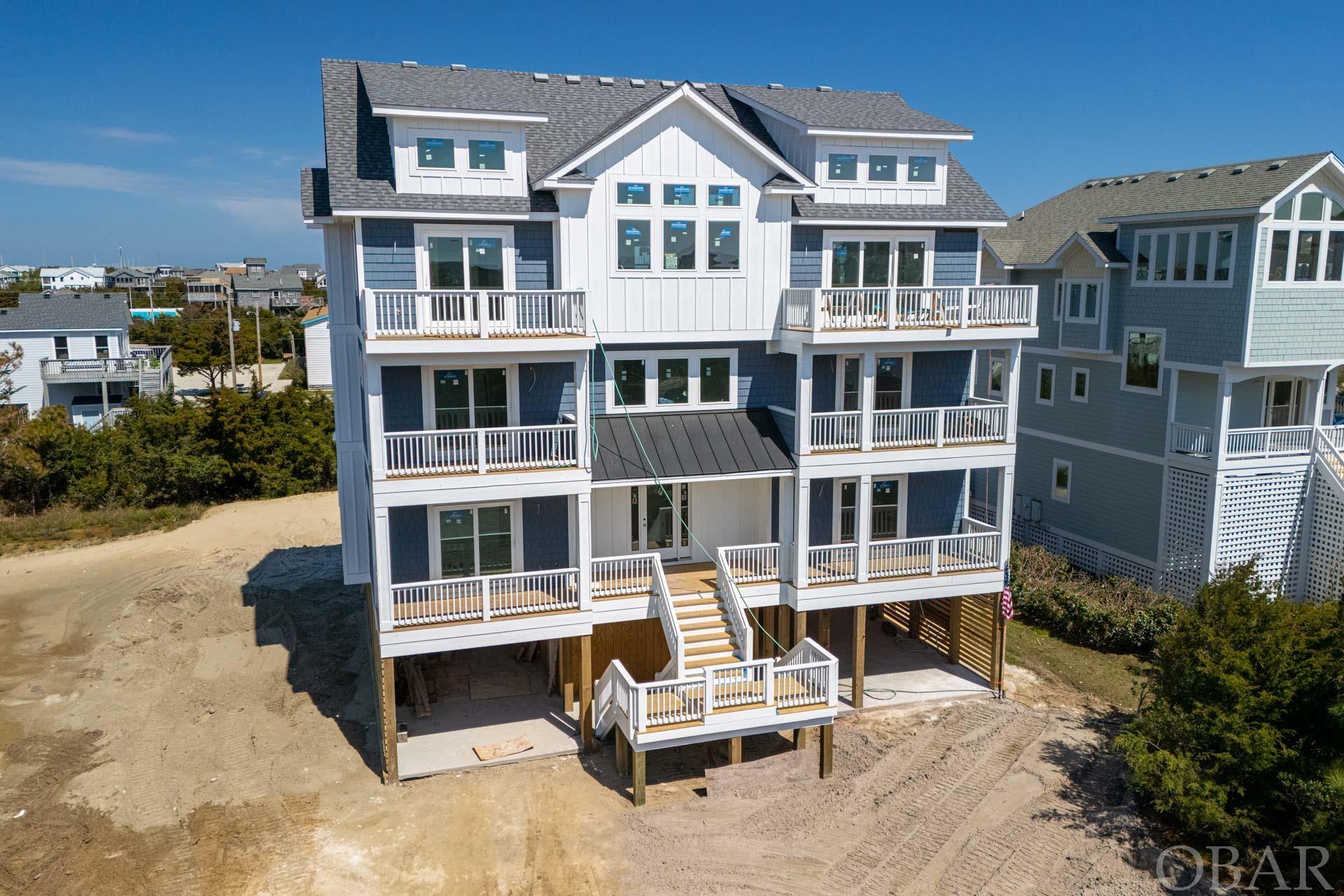 New construction for 2024!  Welcome to your coastal retreat in the upscale community of Hattie Creef Landing in Salvo, NC!  This stunning new construction home is located just 2 lots back from the oceanfront with views off the front decks.    It has easy access to the beach directly through the community.  This is the ultimate in luxury living.  With approximately 5,100 square feet, this eight-bedroom/eight-full and two-half-bath home is perfect for hosting family and friends and is sure to be an incredible rental property!  The top level of the home has an abundance of natural light and boasts a spacious open living area complete with vaulted ceilings, a dining area and a large kitchen featuring two quartz islands for family and friends to enjoy this gourmet kitchen.  Step outside to enjoy the ocean breeze on the multiple outdoor deck spaces and gathering areas. This home is designed for entertainment and relaxation, with a private pool, hot tub, elevator, recreation room, and theater room.  Each bedroom boasts its own ensuite, ensuring privacy and convenience for all guests.  Built in 2024 by Sandalwood Construction, a premier builder with over 40 years of experience designing and building fine homes on the Outer Banks, this home is built to the highest standards of quality and durability. The combination of roof shingles, exterior siding, composite trim, windows, doors, and construction techniques ensures low maintenance and a sustainable home for years to come. Don't miss your opportunity to own this coastal oasis!  Schedule your showing today and start enjoying everything that Hatteras Island has to offer, including pristine uncrowded beaches, world-class kiteboarding and surfing, fishing, and amazing local restaurants. The home is sold fully furnished and completely rental ready with beautiful furniture and decor. Smart tv's throughout the home and in every bedroom. This an amazing new construction opportunity!!