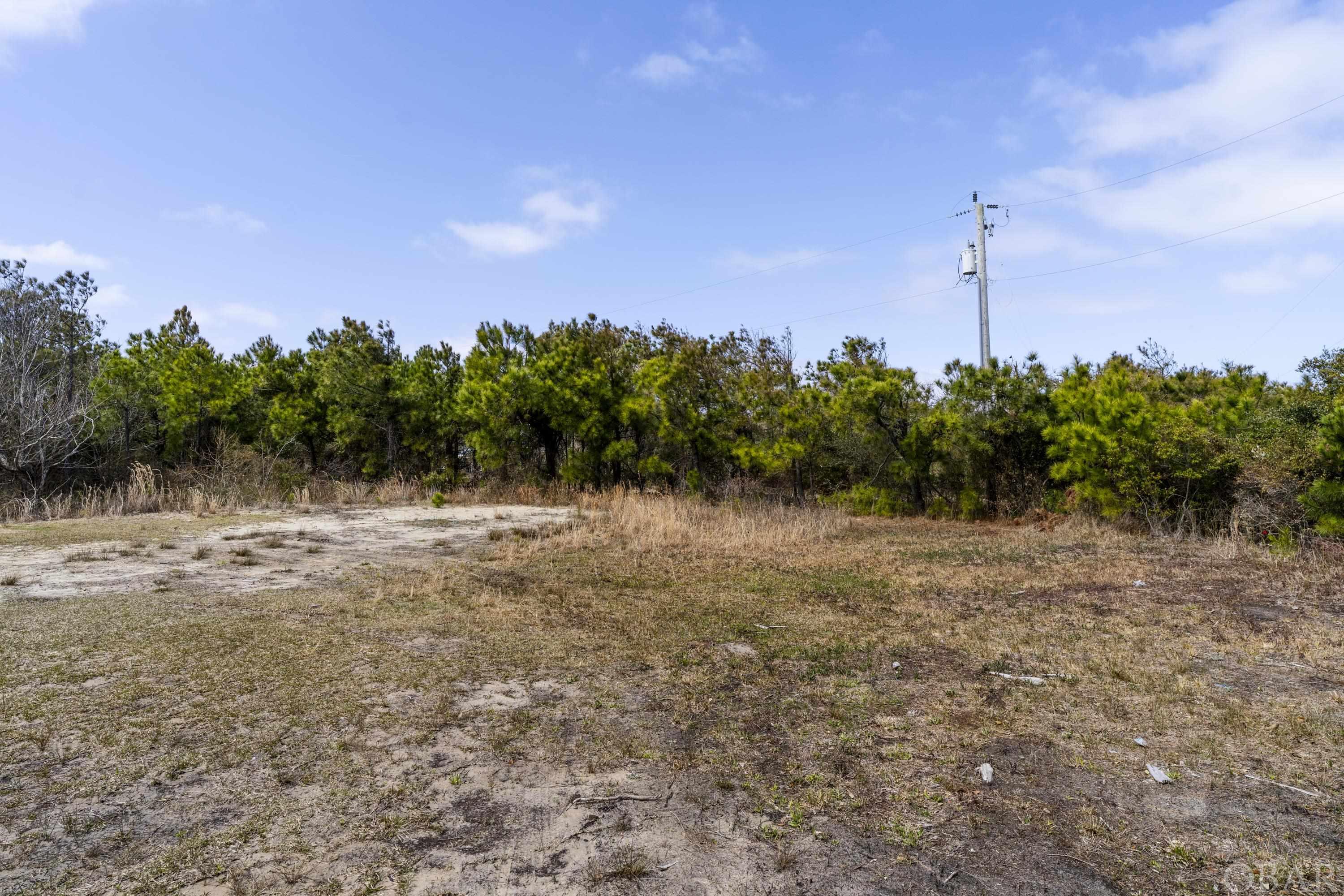 Fantastic opportunity to own this cleared corner 4th row lot in Carova Beach!  Located in the desirable X flood zone, the owners have cleared the lot, had it surveyed, and performed a soil test resulting in a huge cost savings for the future Buyer.  This would make an ideal location for a second home or a weekly vacation rental.  A future 2 story home will have ocean views!  Come check out this private location on the remote 4wd beaches of Carova known for its natural beauty and the resident wild horses that roam freely through the area.