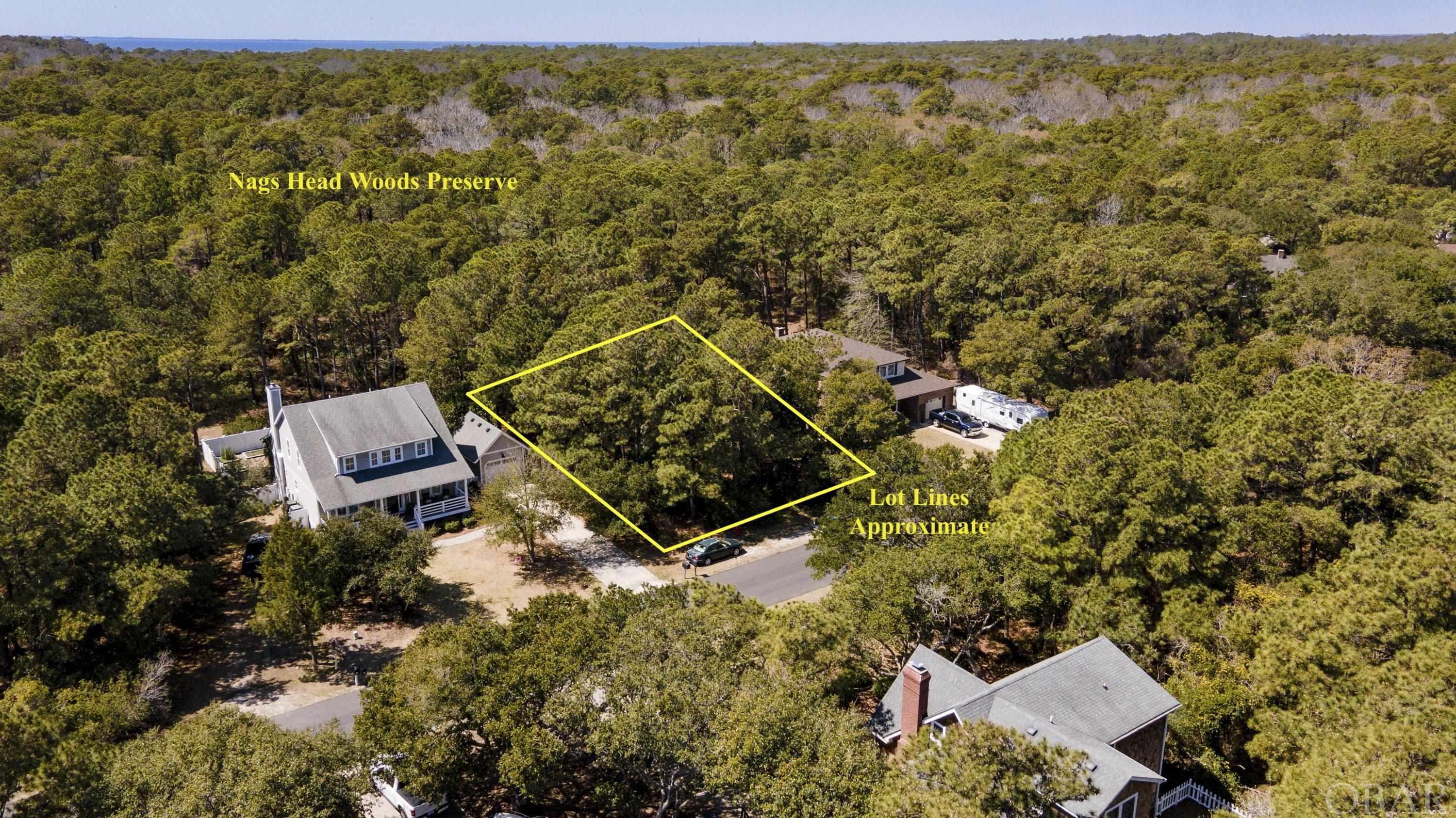 The perfect place to build your dream home on the Outer Banks. Don’t miss this rare opportunity to own one of the few lots in the desirable Nags Head Acres neighborhood that backs up to the Nags Head Woods Preserve. Offering a combination of the peaceful undeveloped nature preserve in your back yard and being centrally located in Nags Head with a grocery store, beach access, multiple restaurants, shops, and so much more all less than 1 mile away.