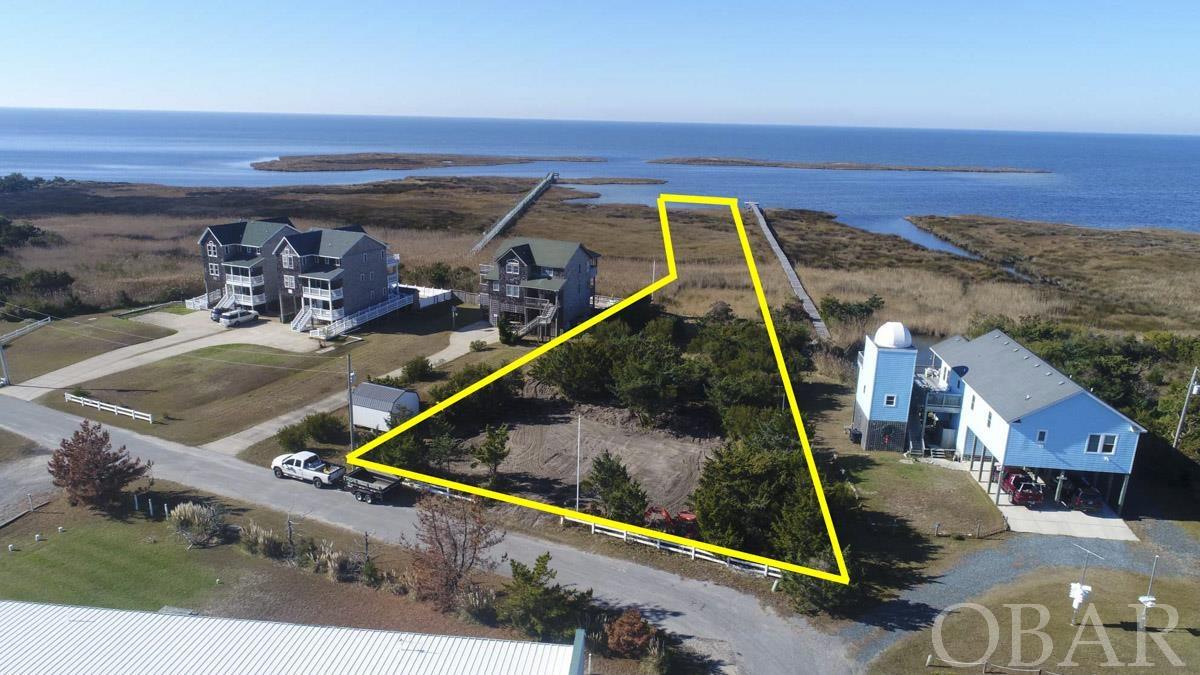 Here it is. A great opportunity to secure this 1+ acre soundfront homesite, right on the famed "Slick". Kite boarders Paradise! 6 bedroom site plan and septic permit in file along w/dock permit.