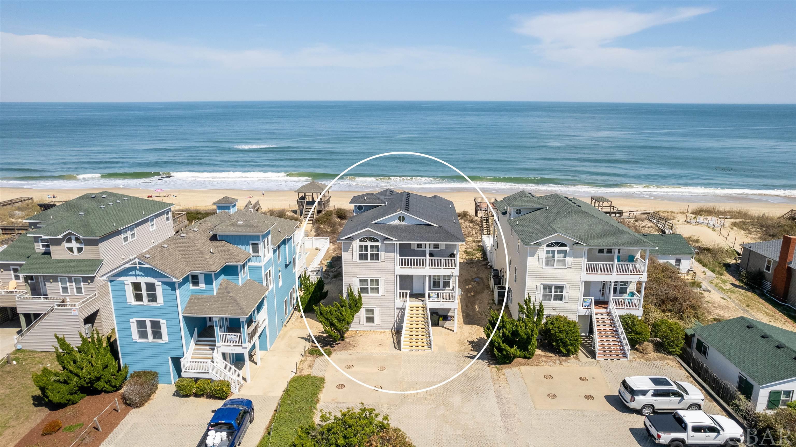 *$25,000 FURNITURE CREDIT AT CLOSING* Incredible investment opportunity to own a 10 bedroom Oceanfront in the heart of Nags Head w/ over 10% GRR in 2023!  Almost every room in this home features a stunning Ocean View, and the top level primary suite has its own private balcony with views of Jockey Ridge State Park.  You cannot ask for a better location in Nags Head!  The reverse floor plan allows you to soak in the Ocean Views while socializing between the spacious open plan Kitchen, Dining, and Living Room area.  The top level primary suite is a great escape offering a jetted tub and private balcony overlooking Jockey's Ridge State Park with incredible sunsets.  There is plenty of room to spread out and entertain as the property also offers a ship's watch with card table off the living area, along with a mid level Den and Ocean View Game Room.  Yes, you read that correctly!  A mid level Ocean View Game Room ... not on the ground level, so you can play AND enjoy the stunning water views at the same time!  A handicap friendly elevator also makes for quick and easy access to each level.  Outside the entertainment options continue with a 12x30 private and heated fiberglass pool, 'kiddie' pool, 8 person hot tub, grill, and private beach walkway with a large sun deck to enjoy the views from sunrise to sunset!  This property is ideally located around MP 11.5 and close to several Outer Banks classics including Tortuga's Lie, Bonnett Street beach access, Dowdy Park, Lucky 12 Tavern, the Nags Head Pier, Surfin' Spoon, and Jockey's Ridge!  Not to mention, over $335,000 in Gross Rental Income for 2023, a NEWER Roof ('17), and a NEW Dune Deck ('23), 2 NEW Heat Pumps and Air Handlers ('23), and NEW Kitchen Counters and Sink in Nov. '23!  The 'Salt Palace' is turn key and ready to be your new OBX income producing property in 2024!