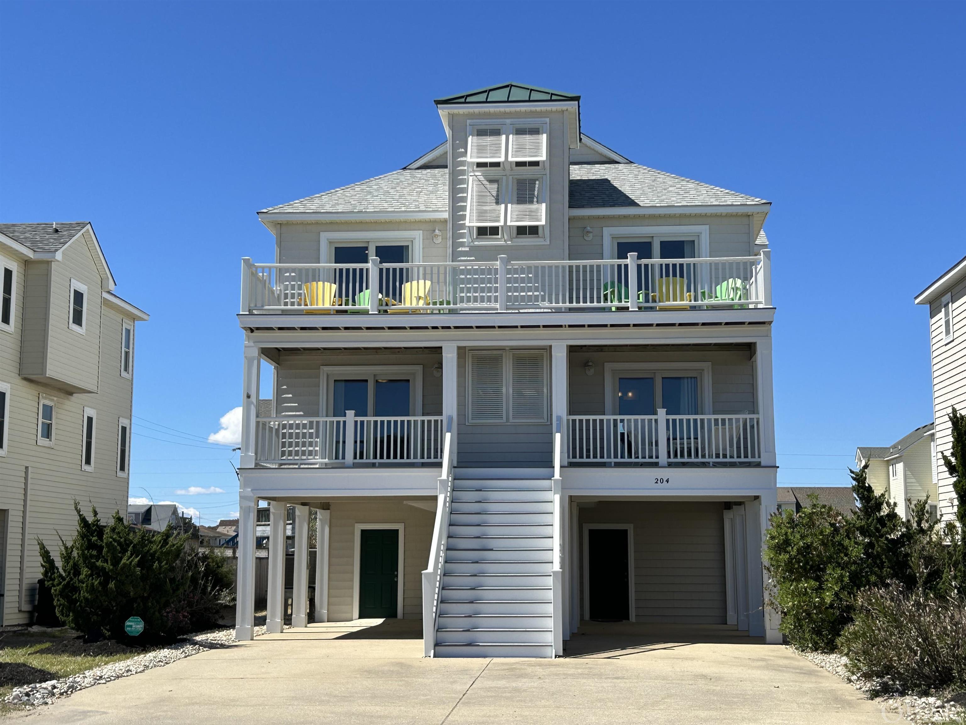 Whether Hosting a Crowd or Escaping to the Beach for Some Quiet Time, This Beach House Will Serve You Well. Diagonally Across the Street from Access to One of the Best, Most Stable Natural Beaches on the Outer Banks. Meticulous Renovations and Updates Have Kept This One-Owner Home in Prime Condition with Aesthetic Improvements. The Cabana, with Its Outdoor Kitchen, Is Featured in the Landscaped, Fenced Pool Area with Plenty of Space for Sun and Fun. Reclaimed Heart Pine from an 1800s Home in Virginia on the Top Floor. Caribbean Heart Pine on the Stairs and Mid-Level. Top Level Living Spaces Include a Shipswatch/Office, a Designer Kitchen with Double Ovens, Two-Drawer Dishwasher, Wine Cooler and More, an Inviting Gathering Room with Gas (Propane) Fireplace and Dining Space for All Plus the Primary En Suite with a True Walk-In Cedar Closet. Sliding Glass Doors for Ocean Views and Access to the Sundeck. Mid-Level Living Spaces Include the More Formal Foyer/Sitting Room, Three Additional Bedrooms, Each an En Suite and One with Access to the Covered Deck, and the Convenient Full-Size Laundry in the Hallway. First Floor Living Spaces Are the Perfect Complement to the Outdoor Spaces with Wet Bar, Countertop Ice Maker, Beverage Refrigerator, Full Bath and Lounging Spaces for TV, Games and Conversation. The Cabana Is Equipped with Gas (Propane) Grill, Beverage Refrigerator, Bar Sink and Ample Cabinetry.