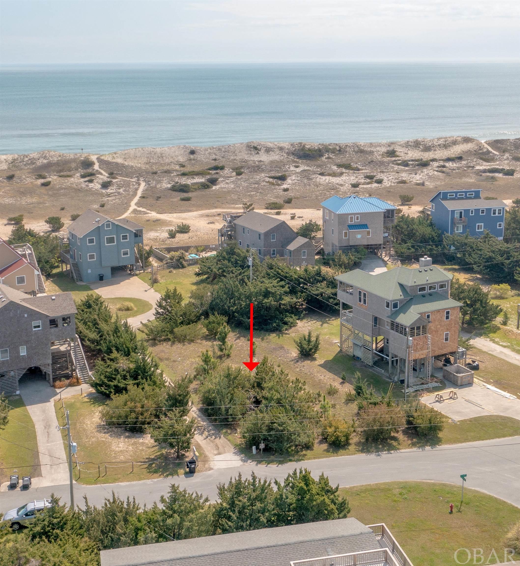 There are not many semi-oceanfront lots left on Hatteras Island and this is a great opportunity to be in Hatteras Colony Subdivision and behind a very stable dune line.  Salvo and the Tri-Village offers several restaurants, surf shops, and amenities plus sound access at the Salvo Day Use Area. This could be your dream home location!