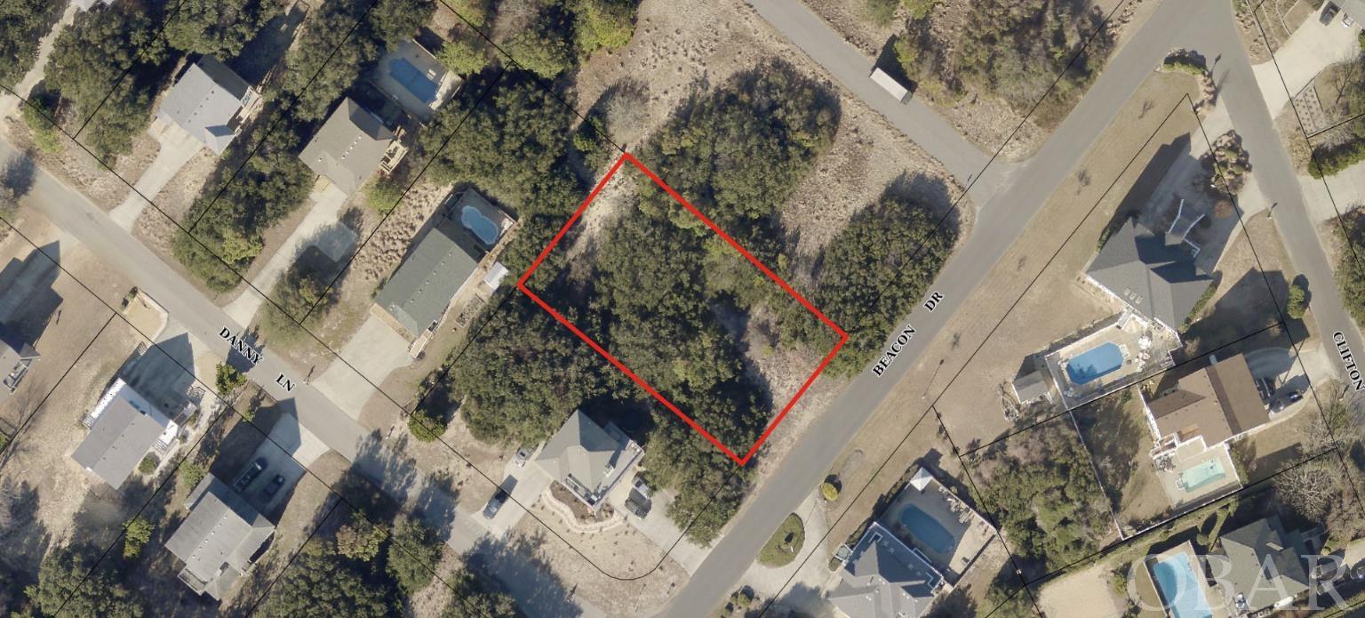 Absolutely incredible location!  Over 1/3 acre of land adjacent to Church property right in the heart of Kitty Hawk.  You'll be blown away by the near 30ft elevations of this high and dry sandy lot located in the X flood zone.  A future home should have great Ocean views and potential Sound views.  Conveniently located to everything, you can walk down to the Sound with the walking/biking trails along the Sound or head right over to the beach.  Location also allows for you to utilize the stoplight by the 7-11 at Kitty Hawk Road to go to the beach or safely pull onto the bypass in the Summer.  Survey has been completed.  Water tap has been paid. 5 bedroom septic permit has been issued.  No HOA to contend with!  This would make a fantastic primary or second home location or vacation rental property.
